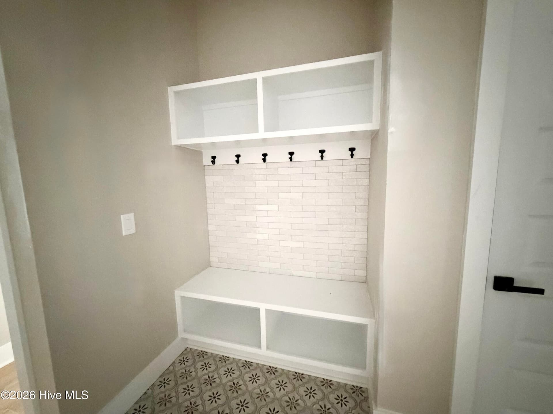 Mud room drop zone with custom tile. - 550 Glenburnie Street NW, Calabash, NC 28467