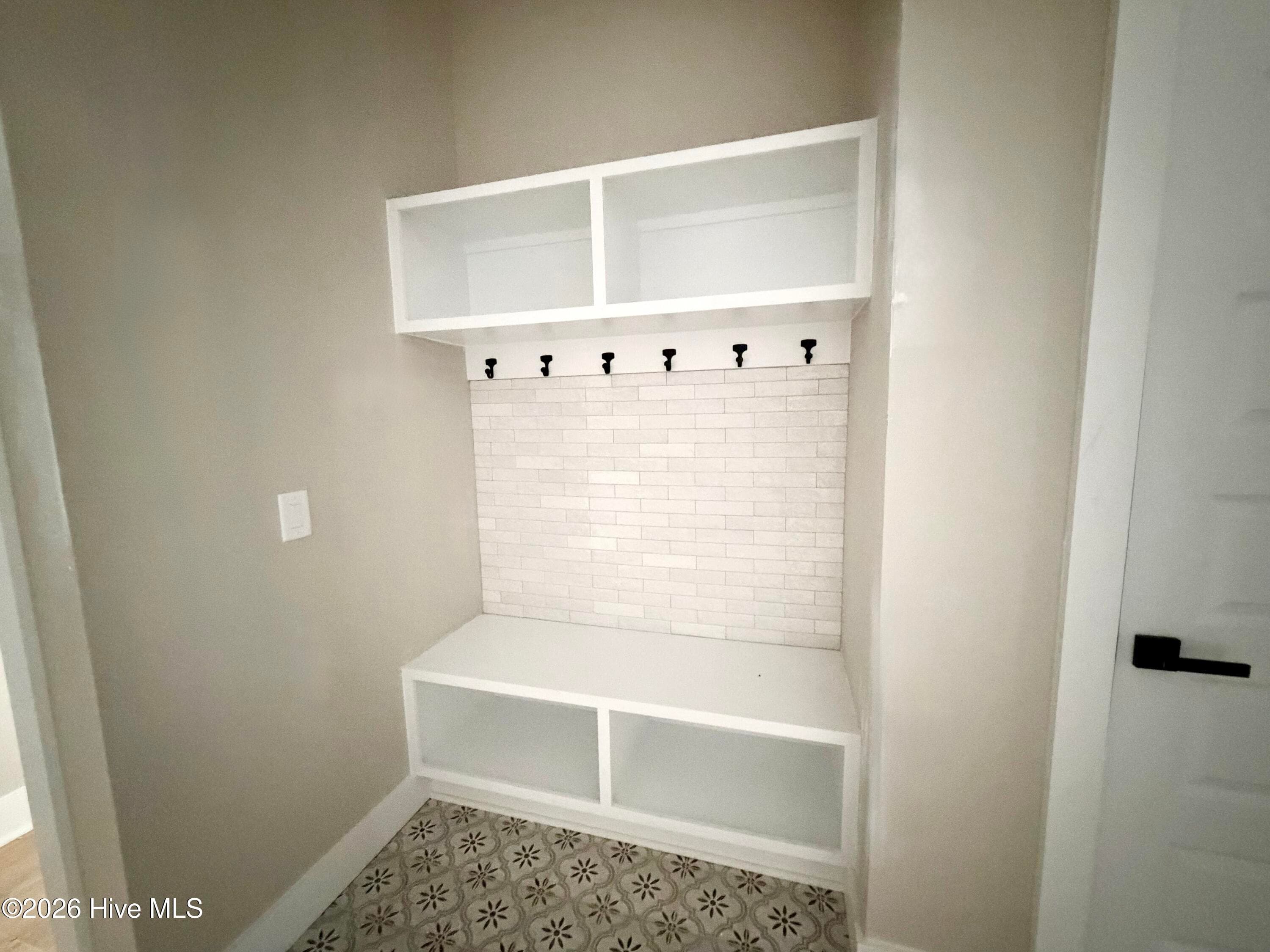 Mud room drop zone with custom tile. - 550 Glenburnie Street NW, Calabash, NC 28467