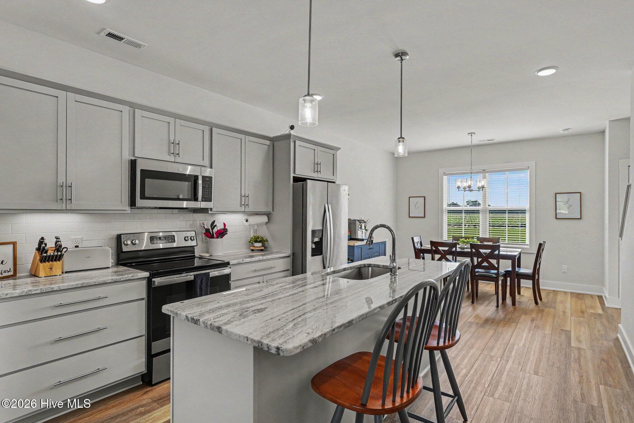 Kitchen breakfast bar - 176 Glenwood Place, Kenly, NC 27542