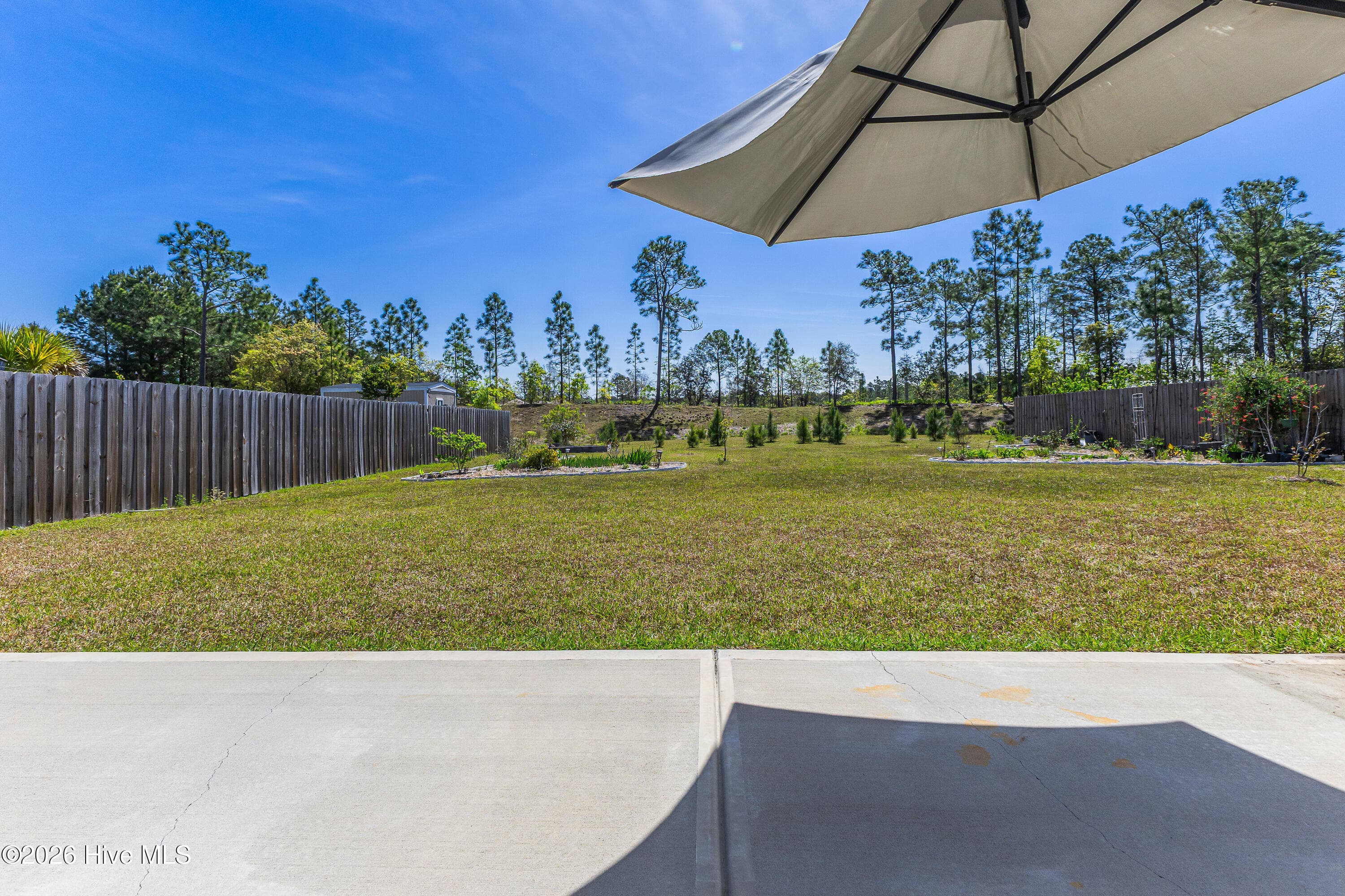 Extra patio great for grilling or soaking up the North Carolina Sun - 1038 Burled Oak Ridge Loop SE, Bolivia, NC 28422
