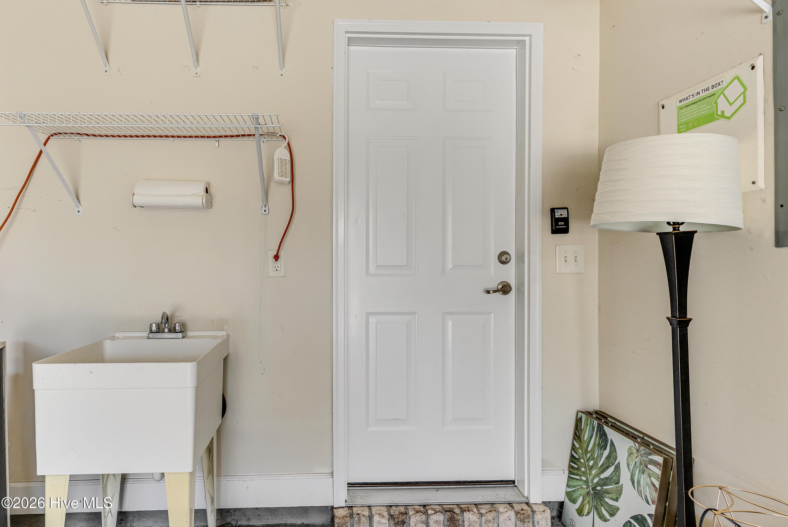 Utility sink and pull down in garage - 4020 Norseman Loop Unit 2, Southport, NC 28461