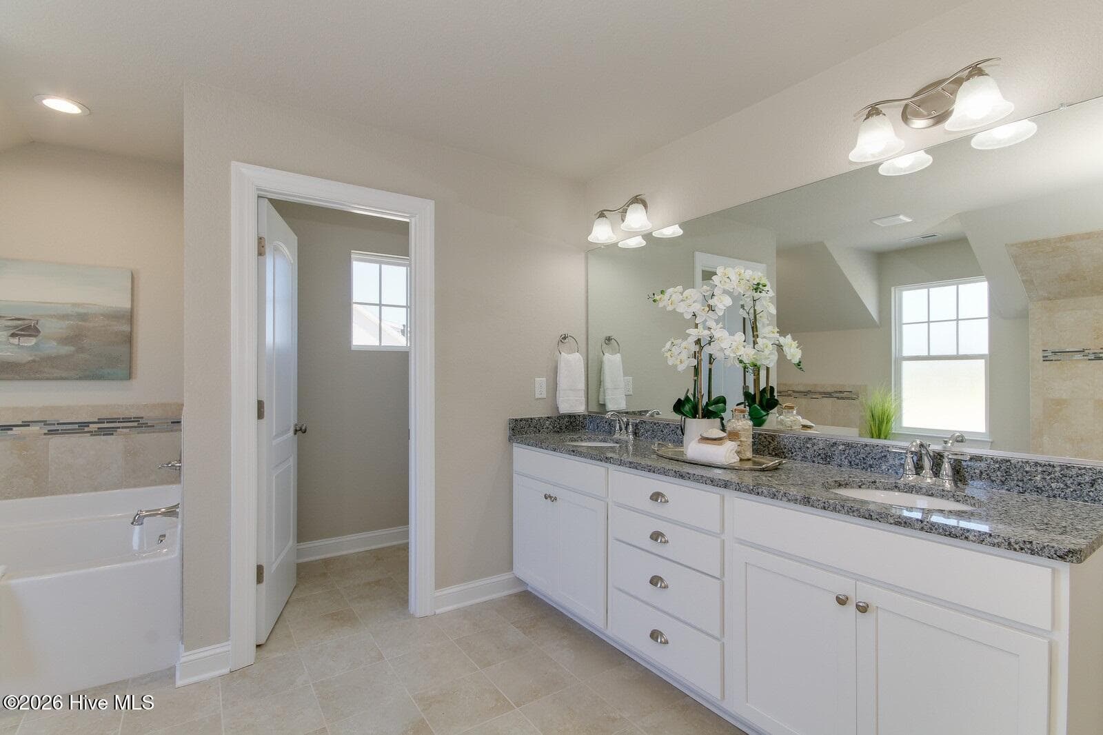 Sample photo of main bath; comes with double vanity, tile floor & granite top - 122 Arbormoor Lane, Moyock, NC 27958