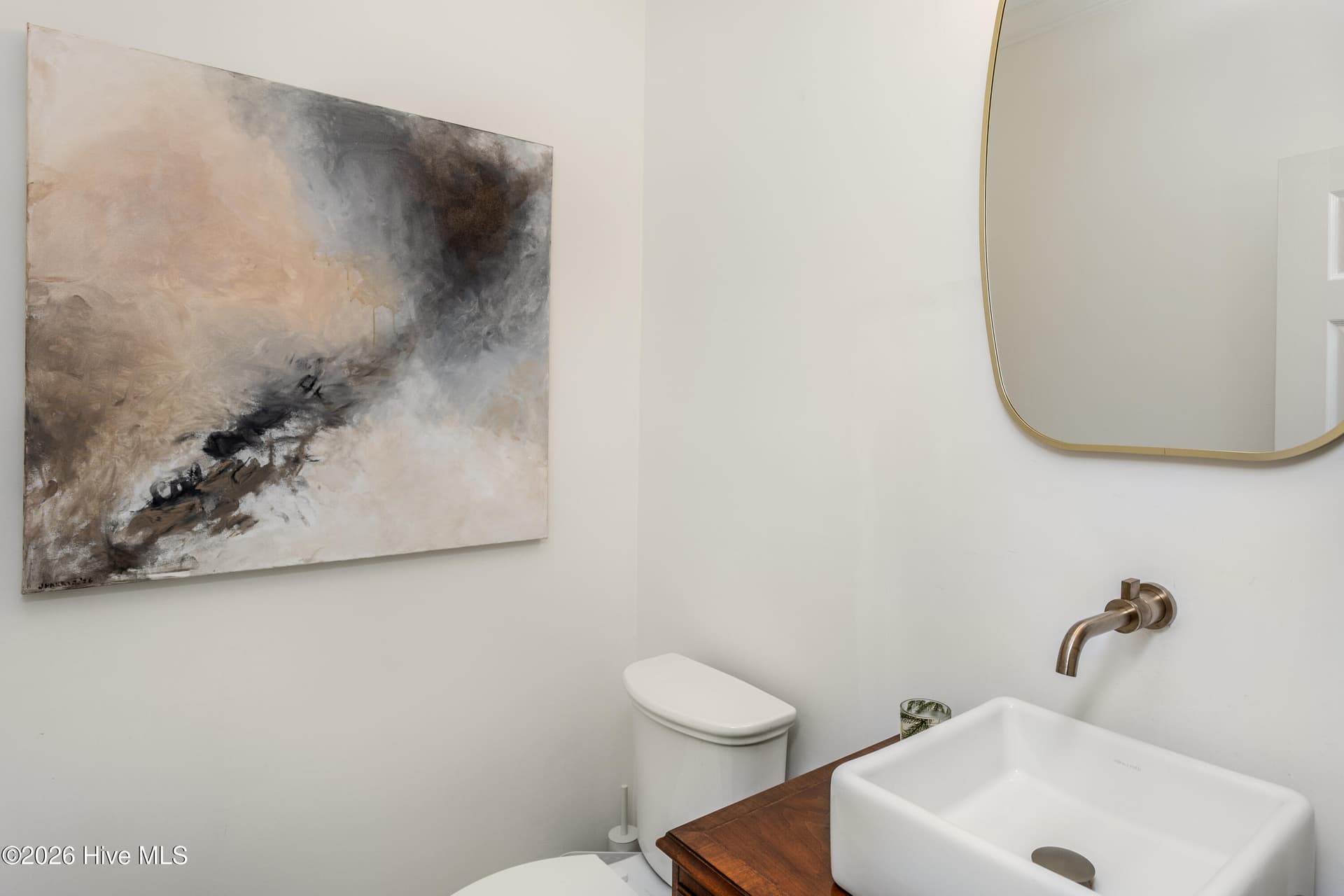 Powder room accessible via rear hallway to large two-car garage, laundry room and rear deck. - 5050 Country Club Drive N, Wilson, NC 27896