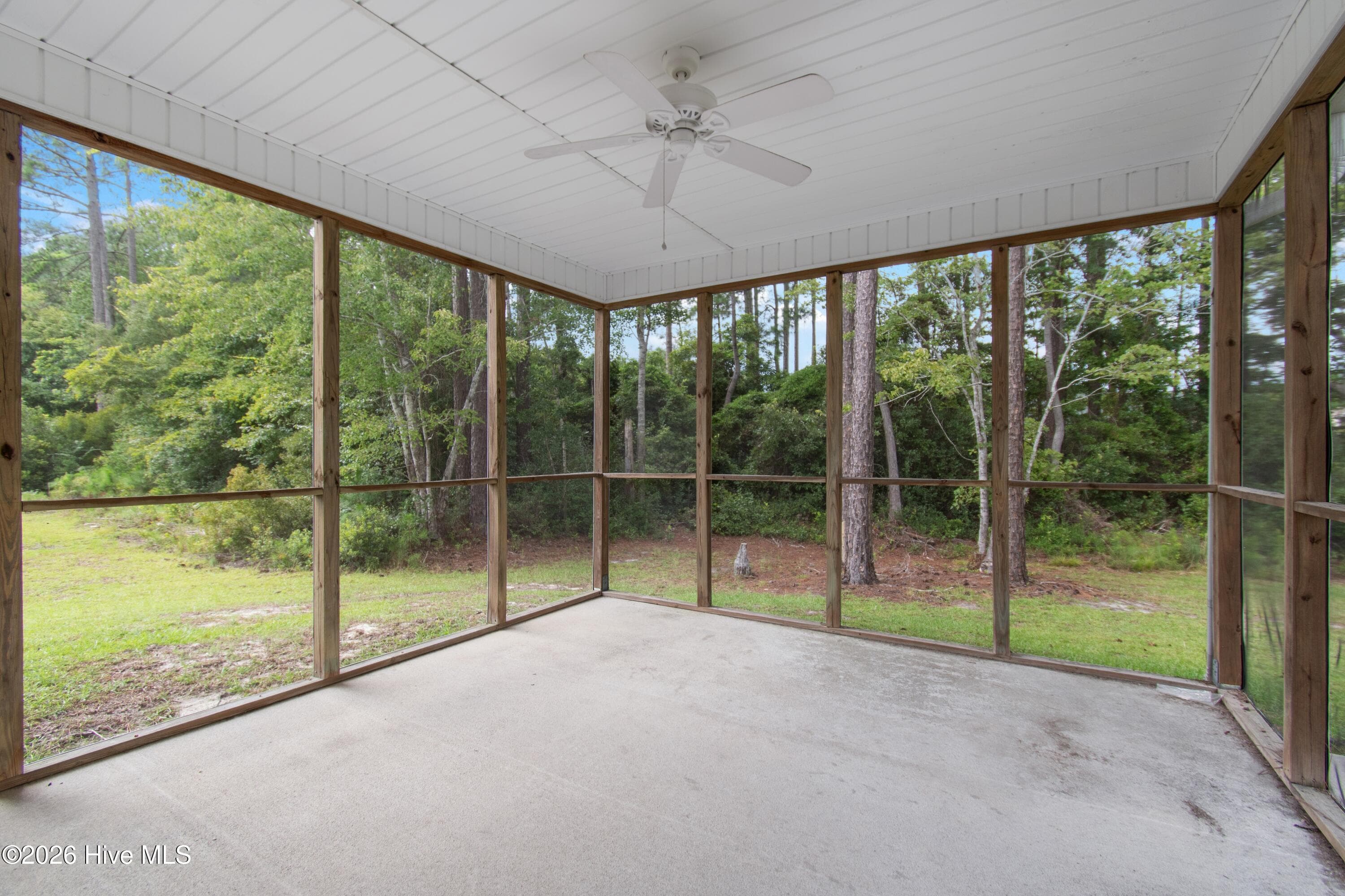 Large, screened porch overlooking wooded back yard. - 709 E Pipers Glen, Shallotte, NC 28470