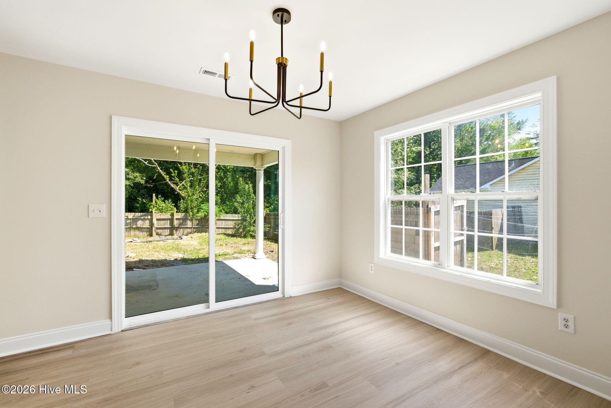 Dining room exit to the rear Porch - 215 Gardenview Court NE, Leland, NC 28451