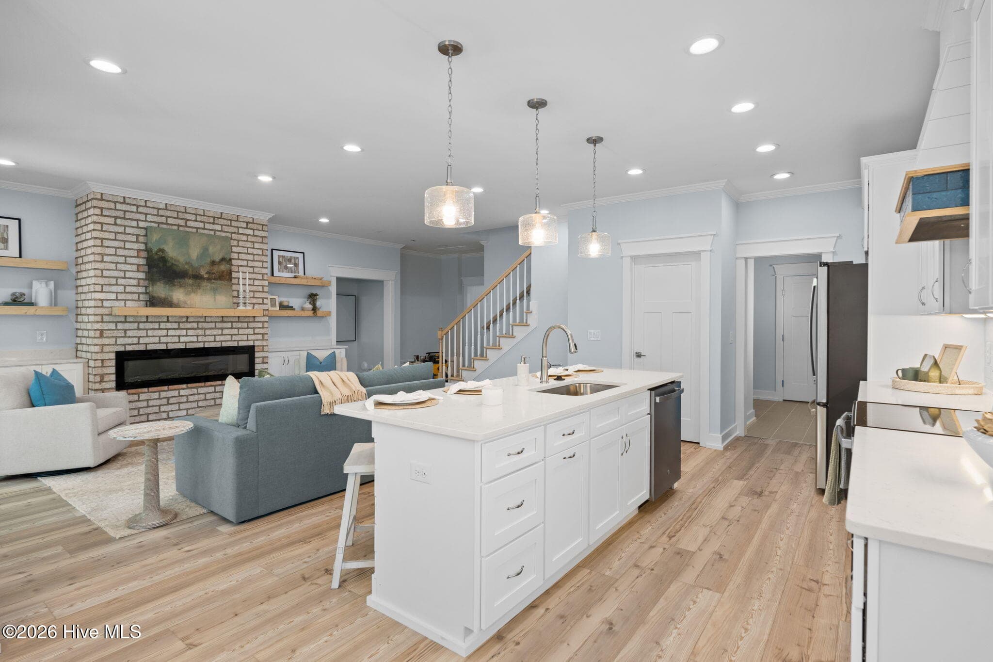 Photos of a staged model of the exact same plan - 312 NE 58th Street, Oak Island, NC 28465