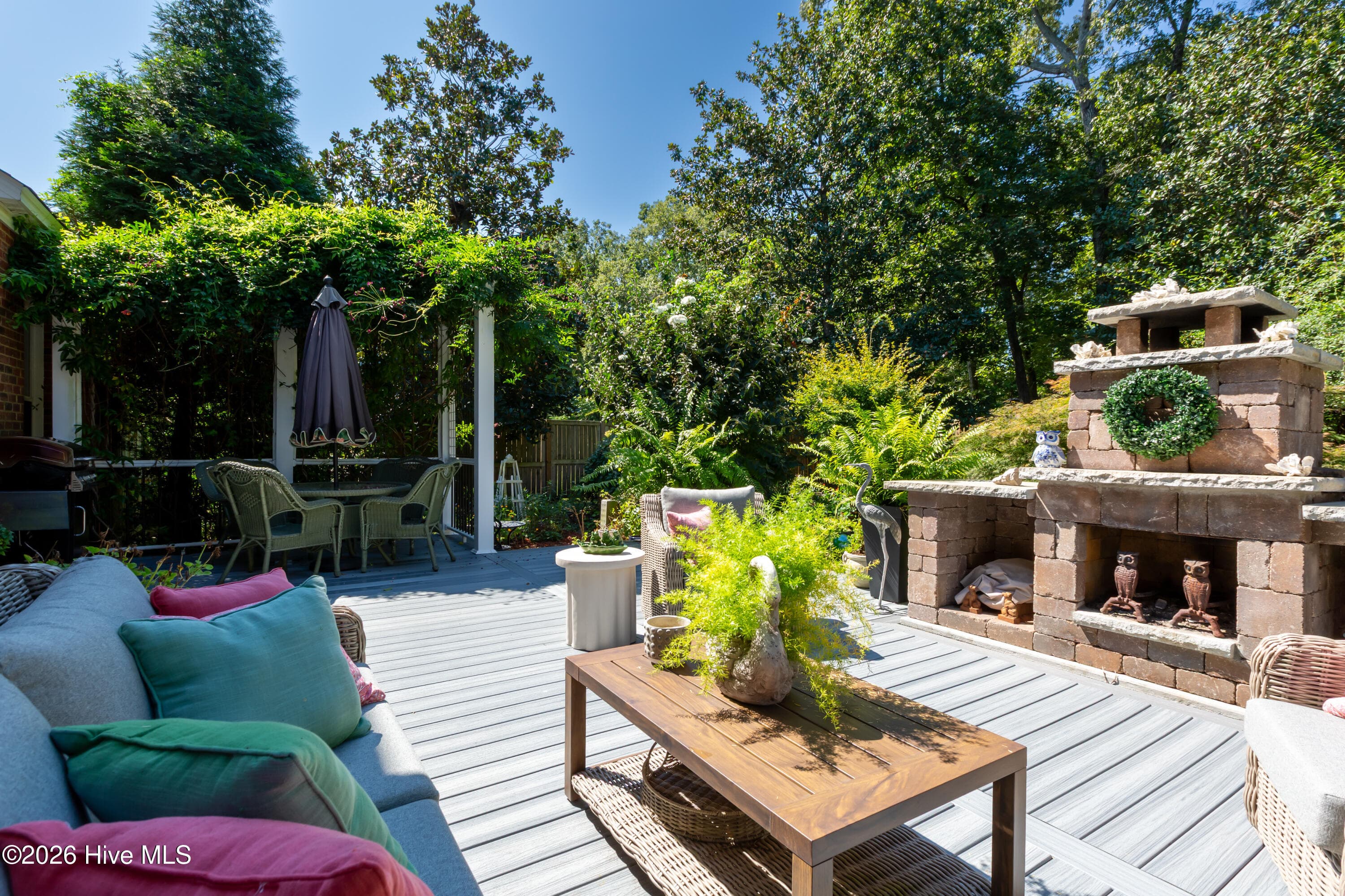 Expansive back deck featuring a wood burning fireplace - 2417 Oakview Drive, New Bern, NC 28562
