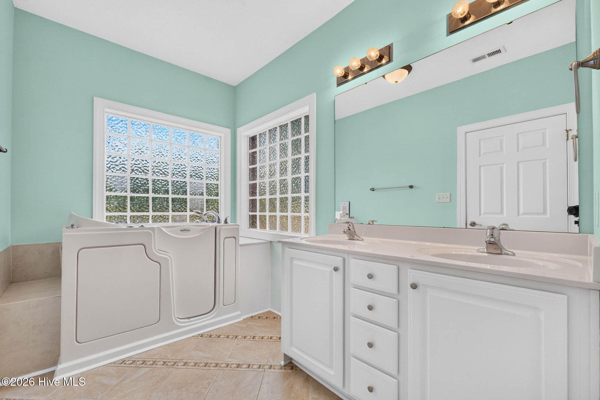 Primary bathroom including walk-in tub - 7825 High Market Street #303, Sunset Beach, NC 28468