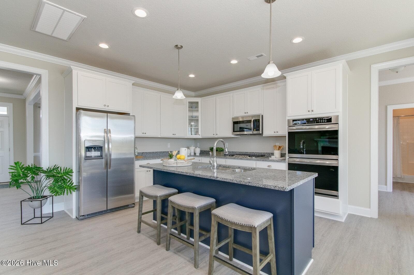 Sample photo: kitchen comes w/ island, double ovens and LVP flooring (frig shown is for sales model only) - 122 Arbormoor Lane, Moyock, NC 27958