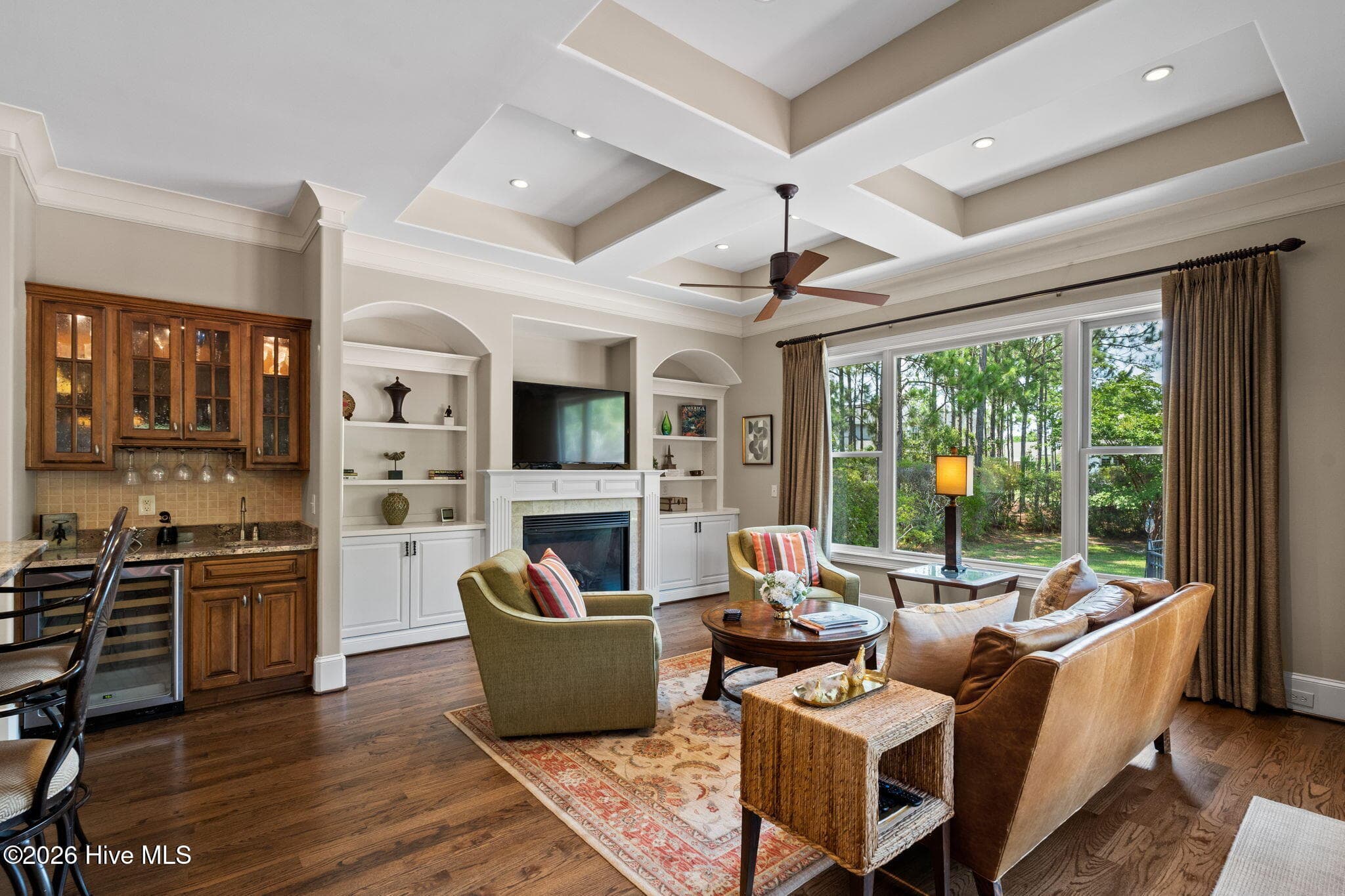 Wet bar with beverage/wine frig transitions to family room - 3858 Ridge Crest Drive, Southport, NC 28461