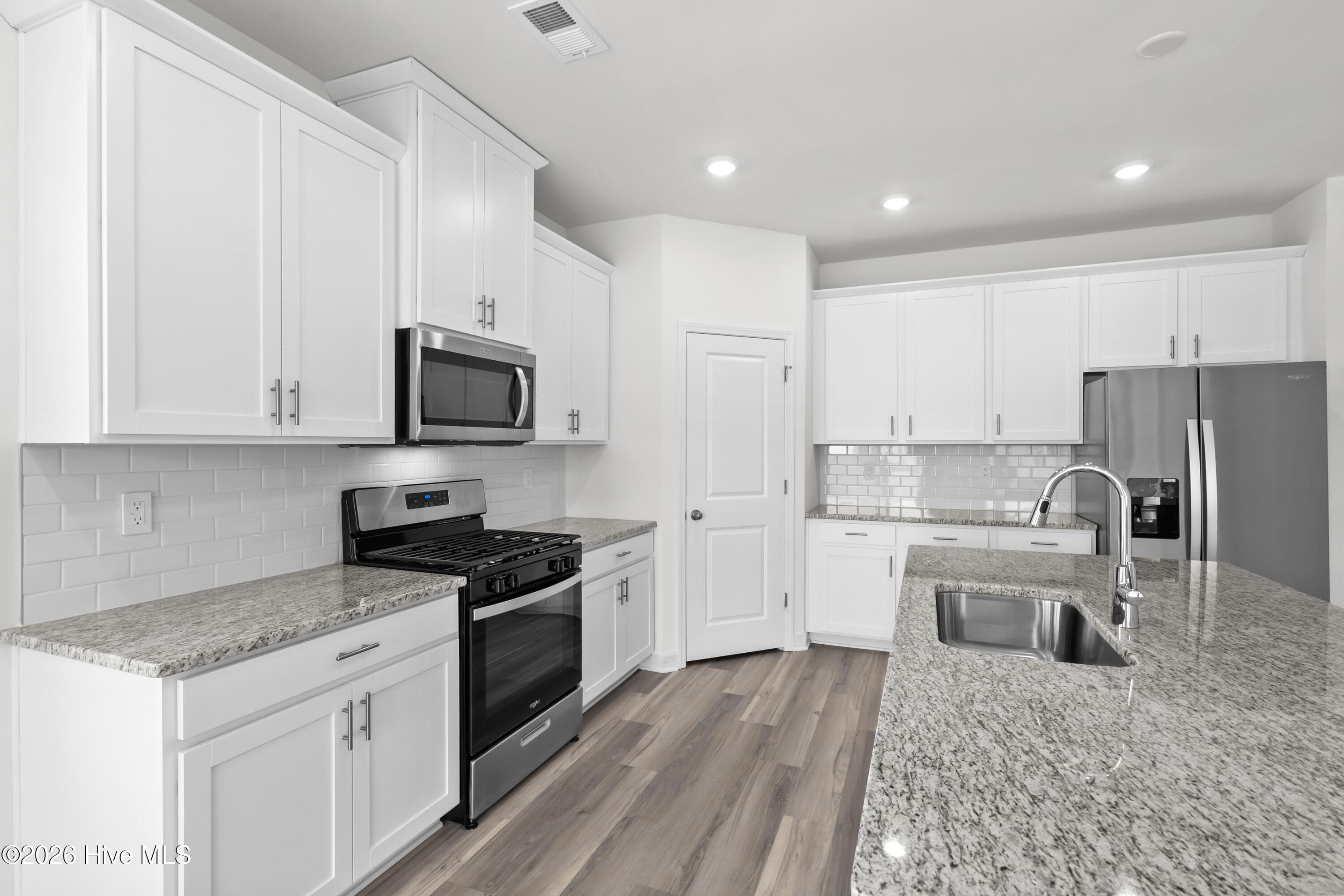 Photo is not of the actual home, but is an example photo of a completed home and may depict options and/or features that are not included - 4154 Generations Circle NW, Ash, NC 28420