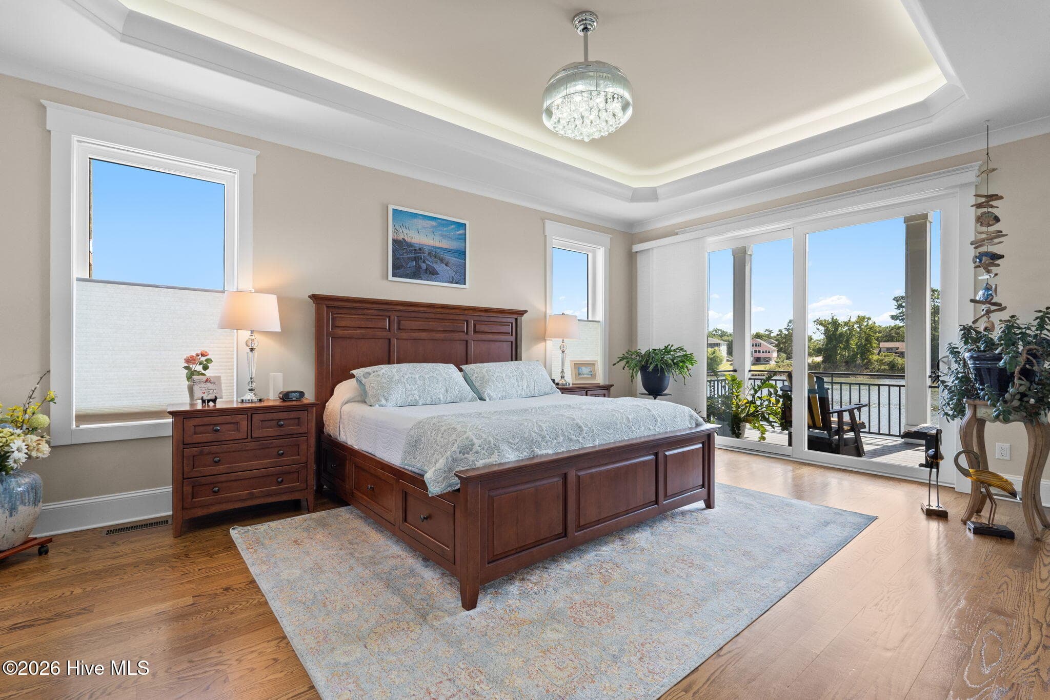 Spacious primary bedroom loaded with natural light - 2775 Long Bay Drive SE, Southport, NC 28461
