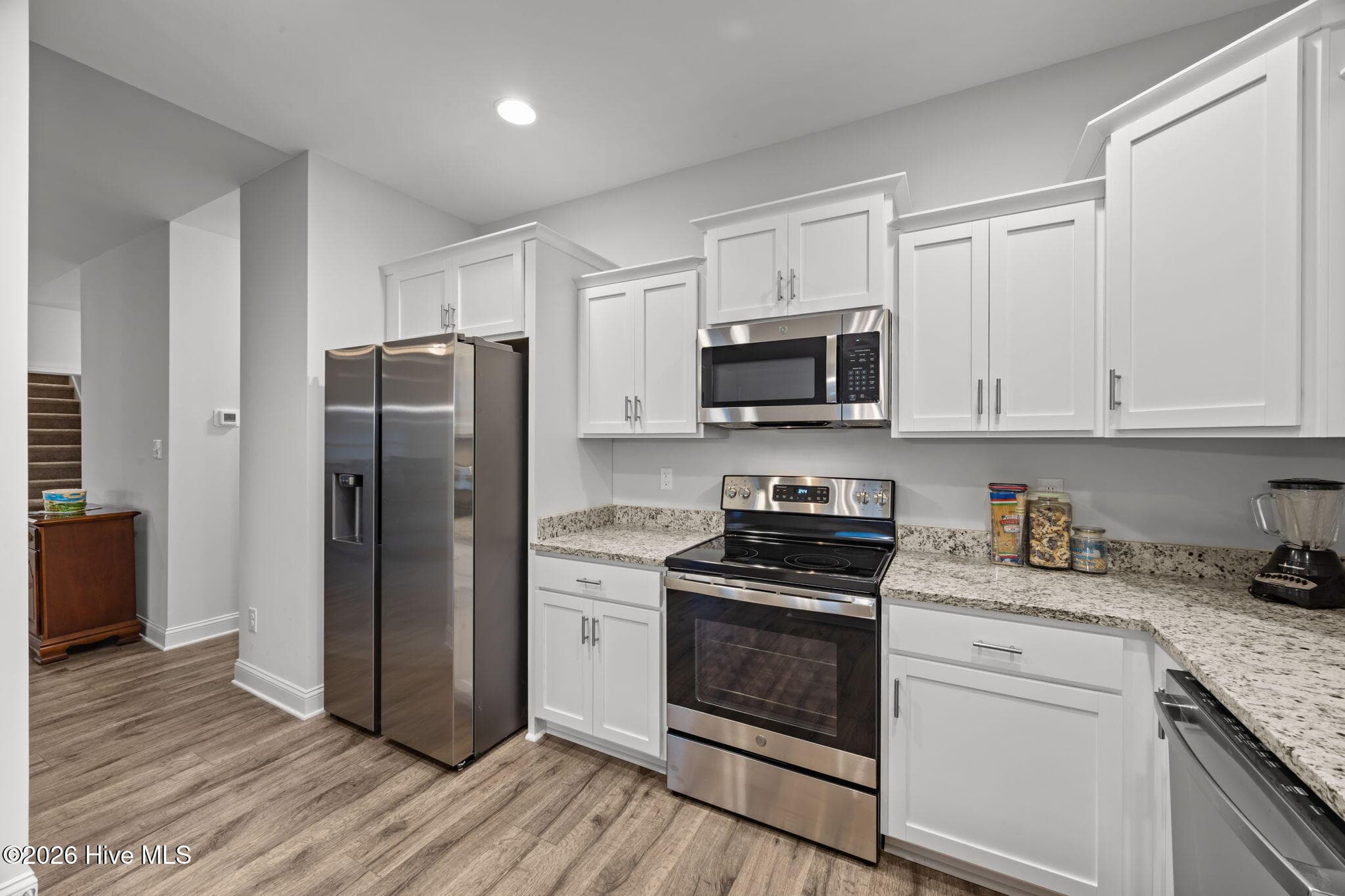 Kitchen - showing the range, microwave and refrigerator. - 3002 Sharpnose Street, New Bern, NC 28562