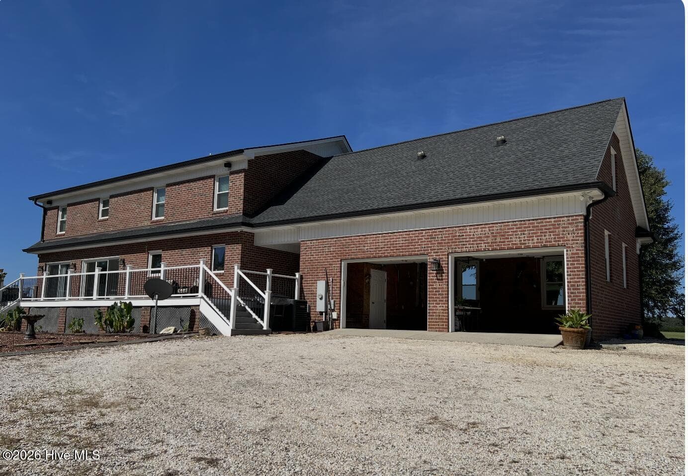 Rear View of house showing garage area. - 642 Enoch Road, Clinton, NC 28328