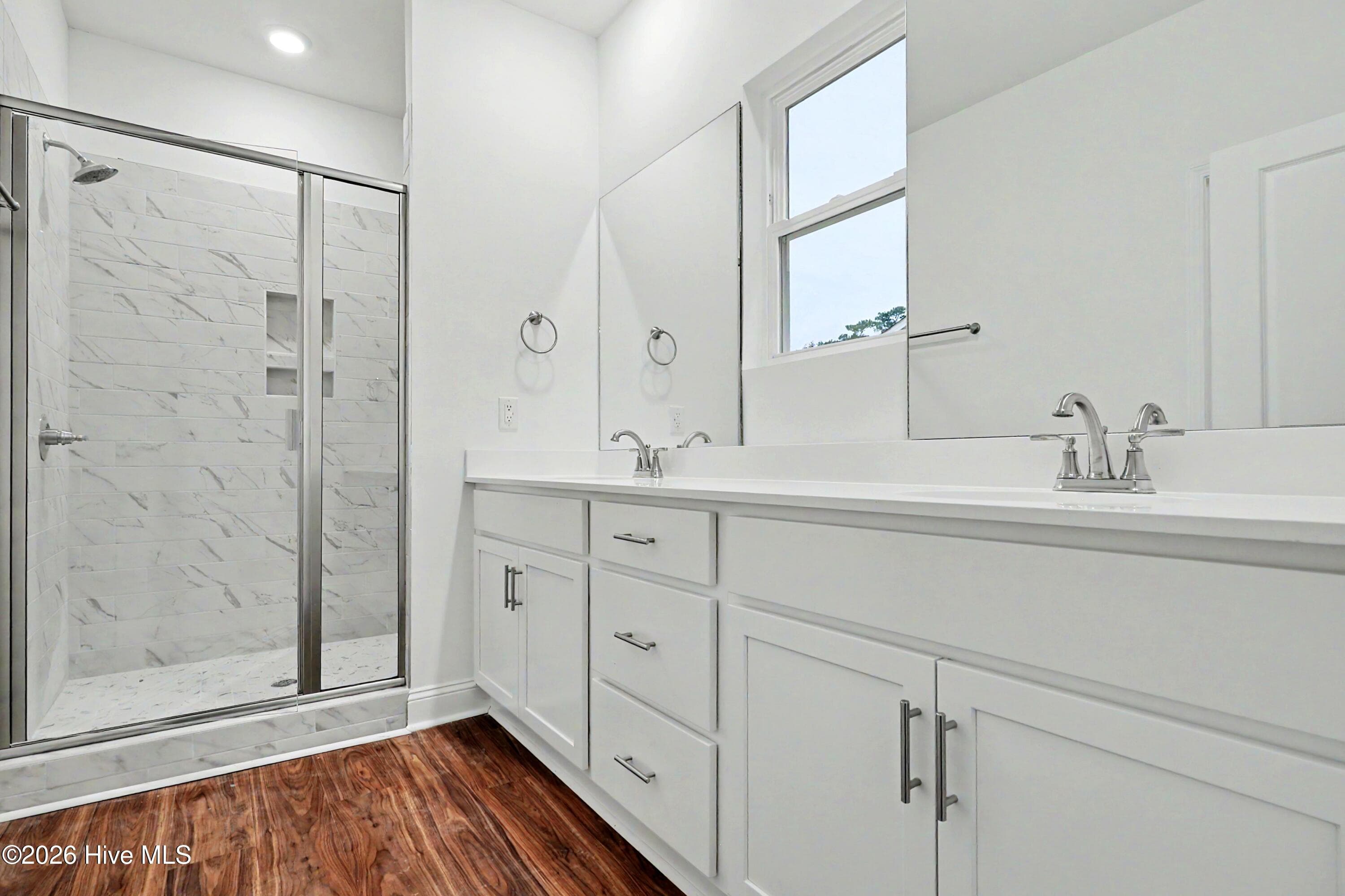 Comfort height counters with dual sinks and added storage in owners bathroom. - 2111 Cregan Cove SW (Lot 19), Ocean Isle Beach, NC 28469