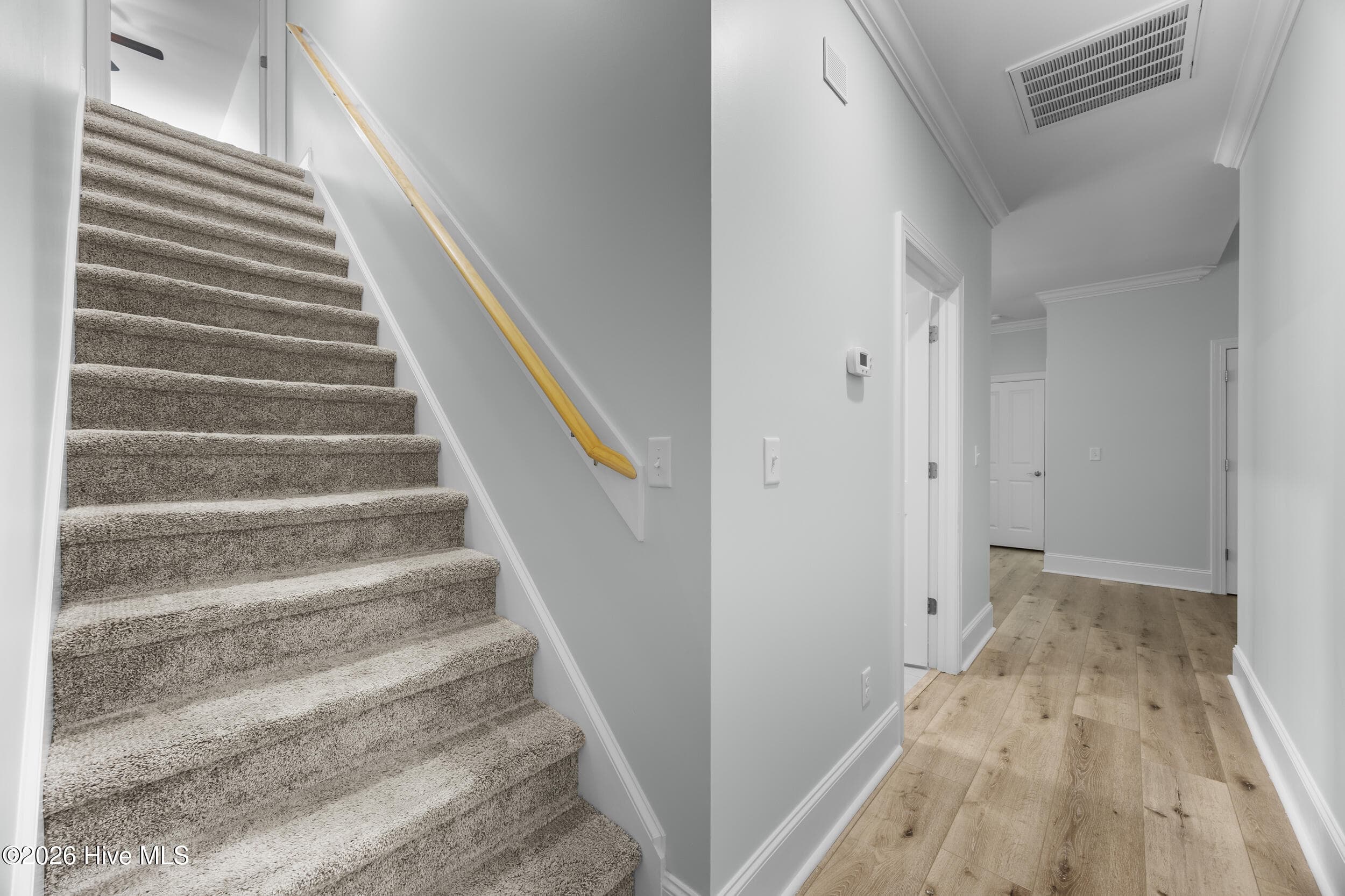 Hallway to bedroom and Stairs - 323 Crown Pointe Drive, Hampstead, NC 28443