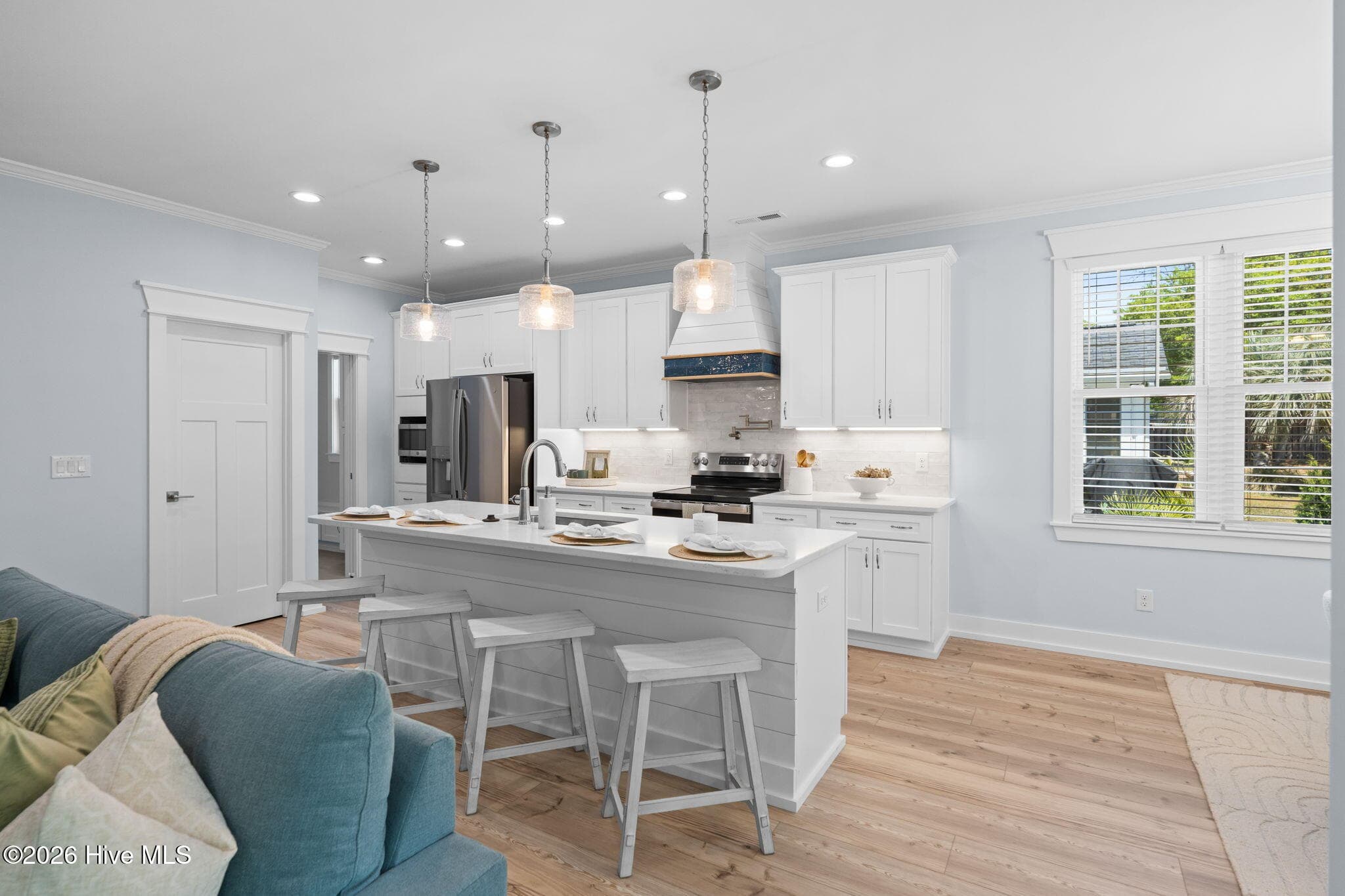 Photos of a staged model of the exact same plan - 312 NE 58th Street, Oak Island, NC 28465
