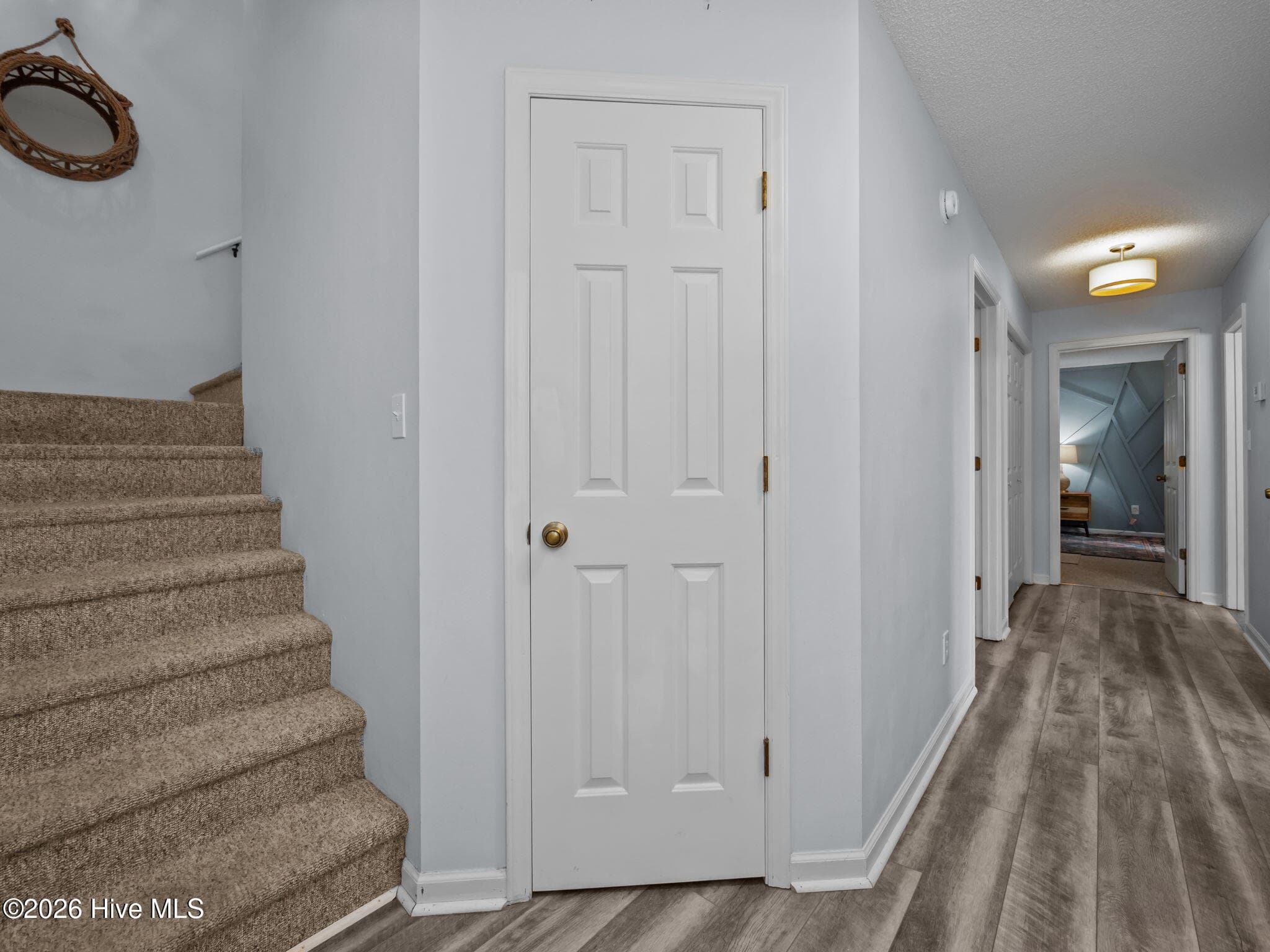 Stairway to BR Level with Entry Foyer Coat Closet - 5415 Cedar Tree Lane, Emerald Isle, NC 28594