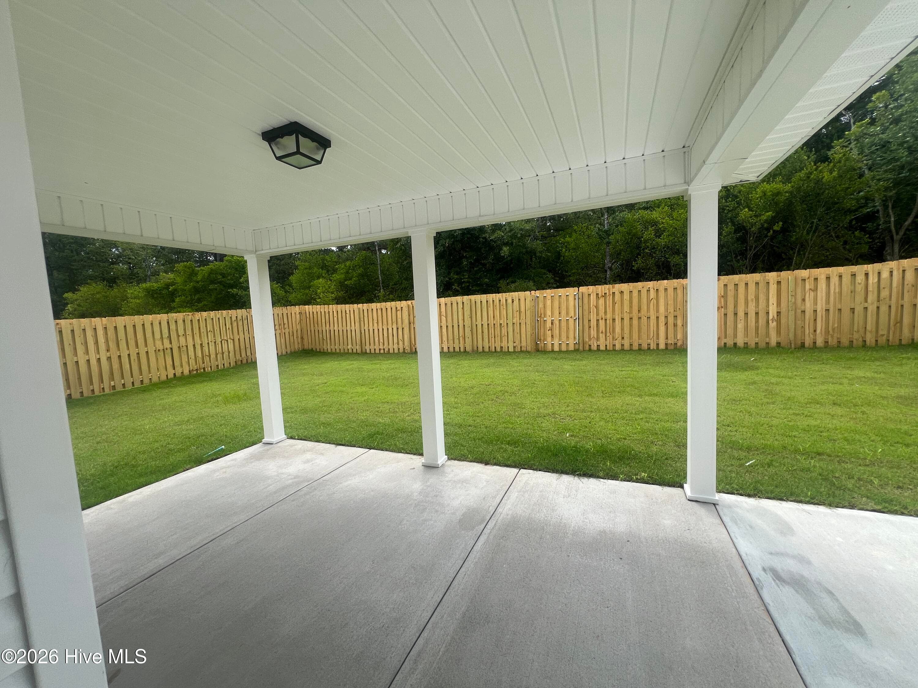 Looking out to the covered porch and nice size backyard. - 8887 Snelling Drive, Aiken, SC 29803