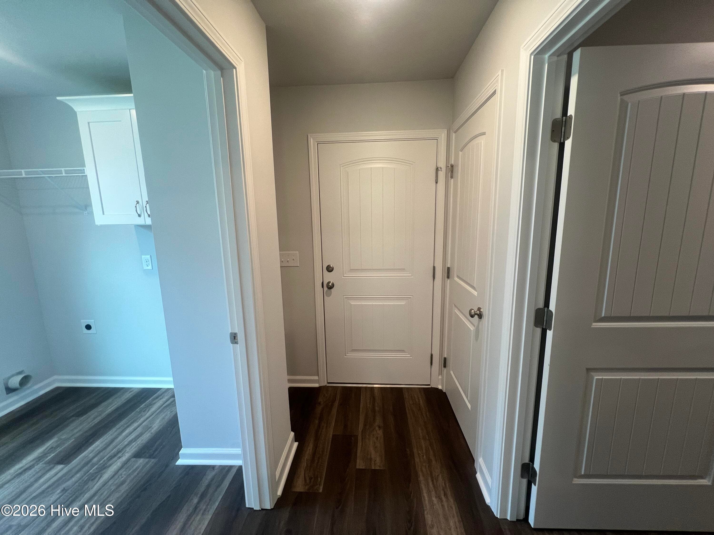 Hallway from kitchen to power pantry, laundry room and garage. Another storage closet to the right. - 8887 Snelling Drive, Aiken, SC 29803