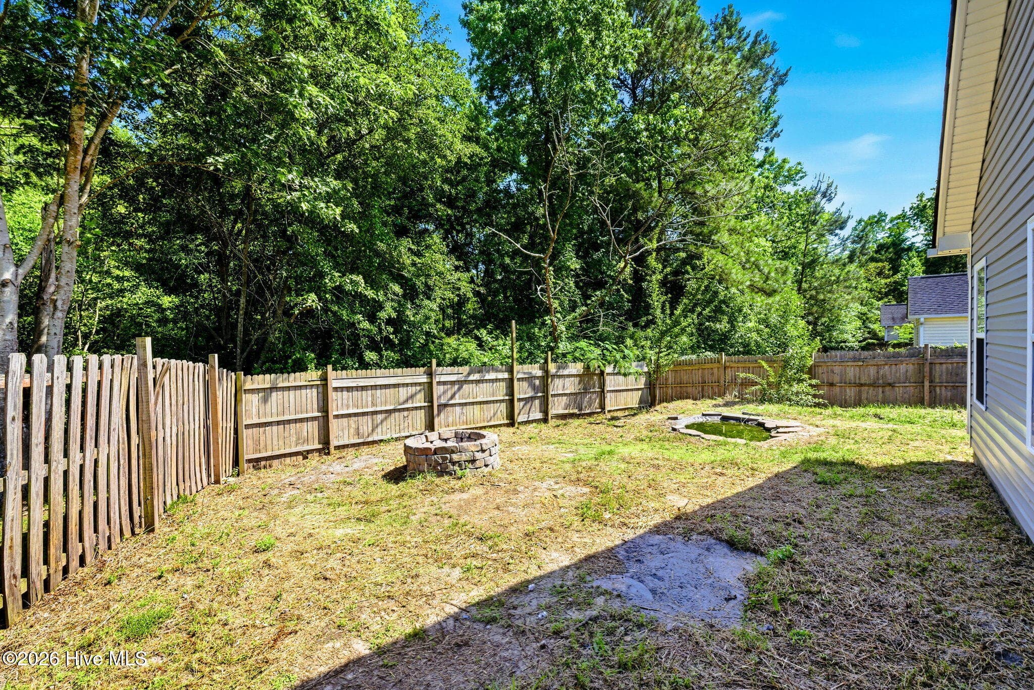 The whole backyard from the left side looking right - 215 Gardenview Court NE, Leland, NC 28451
