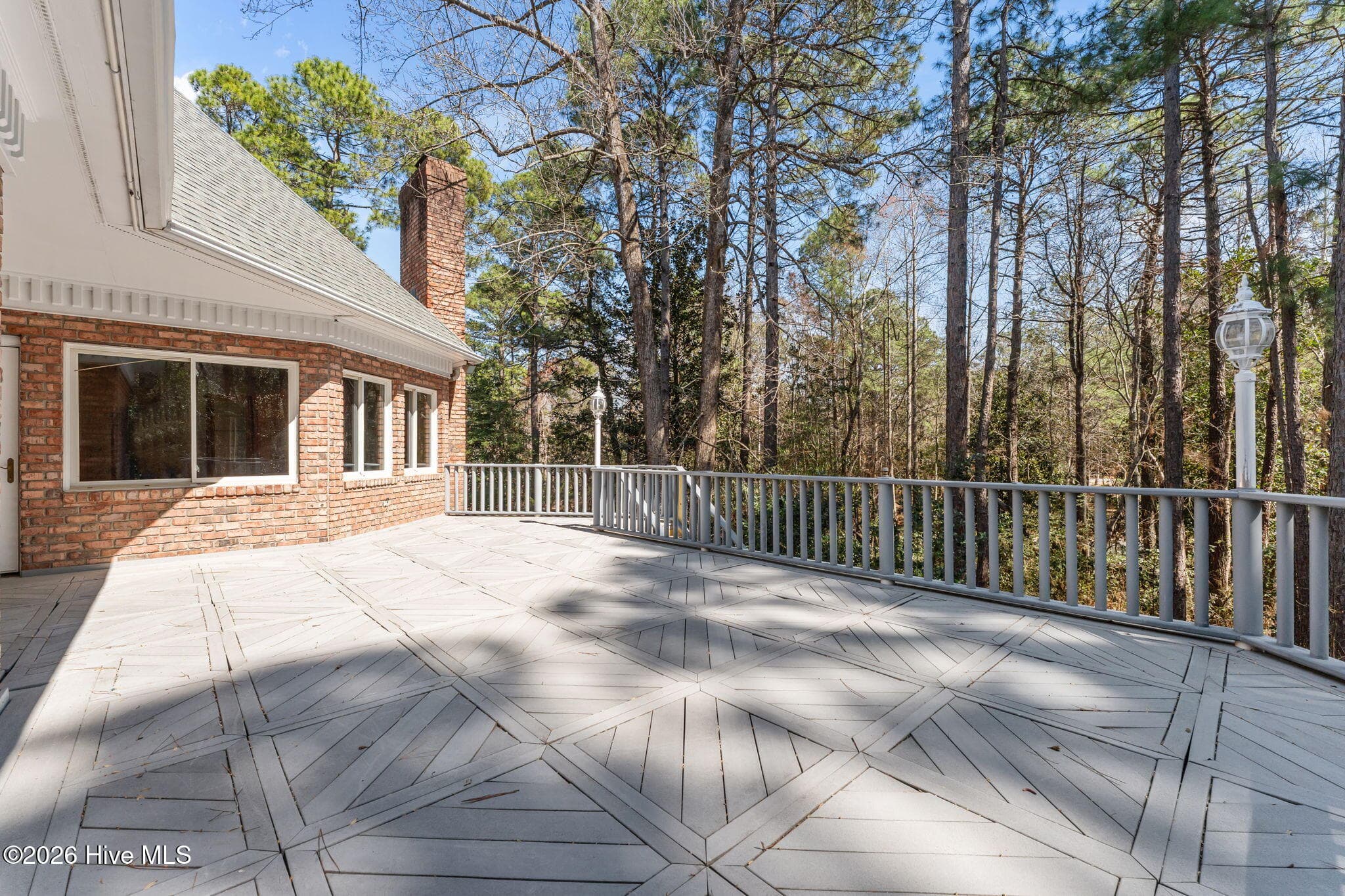 Far corner view of the deck. Lots of space to entertain, relax and catch some rays. - 22 Lochmere Drive, Pinehurst, NC 28374