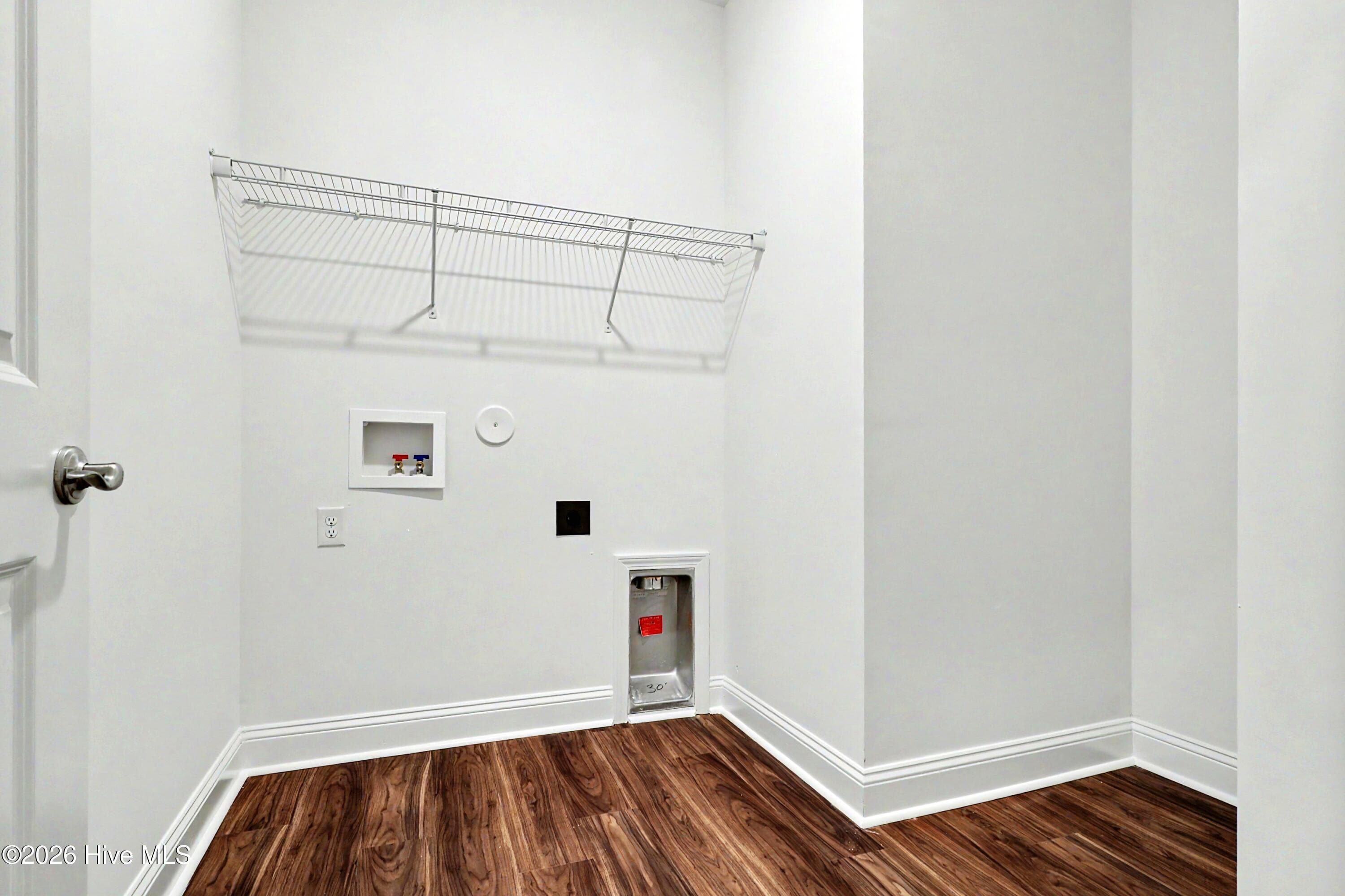 Laundry Room with Door and extra area for additional storage. - 2111 Cregan Cove SW (Lot 19), Ocean Isle Beach, NC 28469