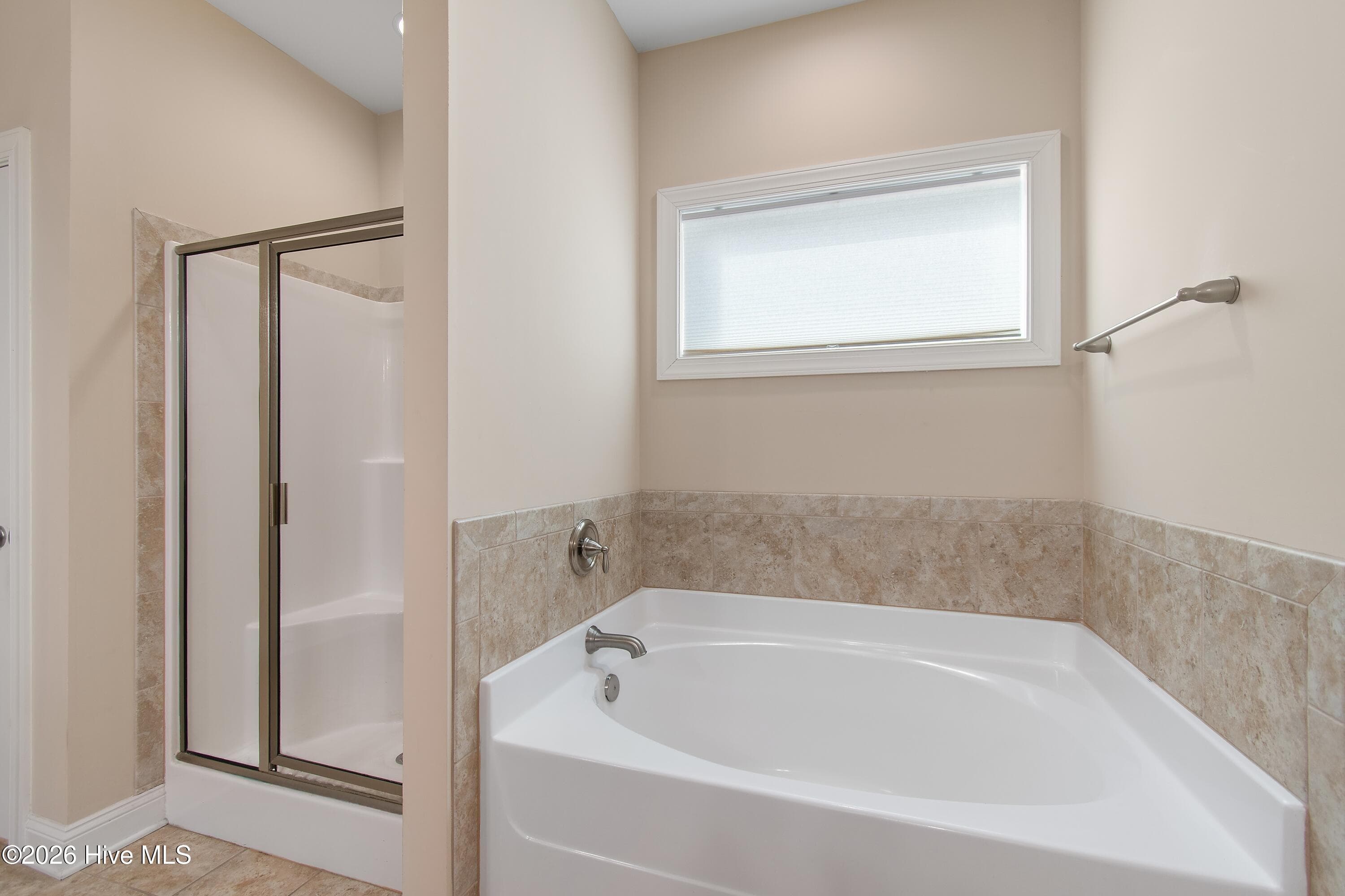 Primary en suite bathroom also features a water closet for privacy. - 1674 Back Bay Drive SW, Shallotte, NC 28470