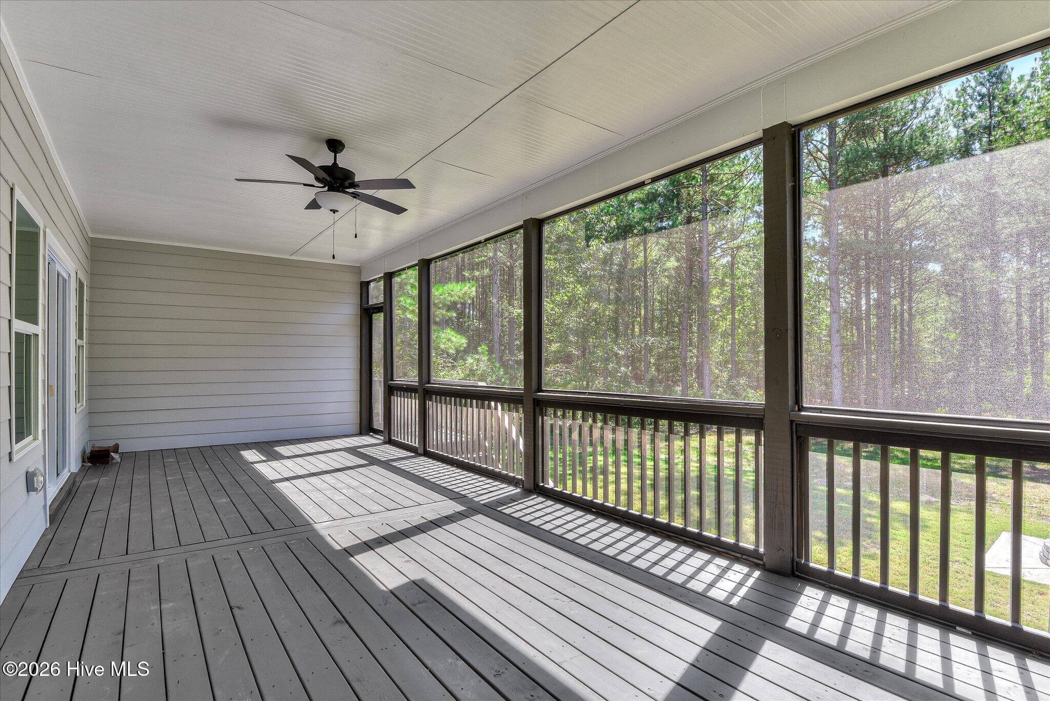Screened porch stretches across the back of the home. - 1198 Sunset Cove, Tignall, GA 30668