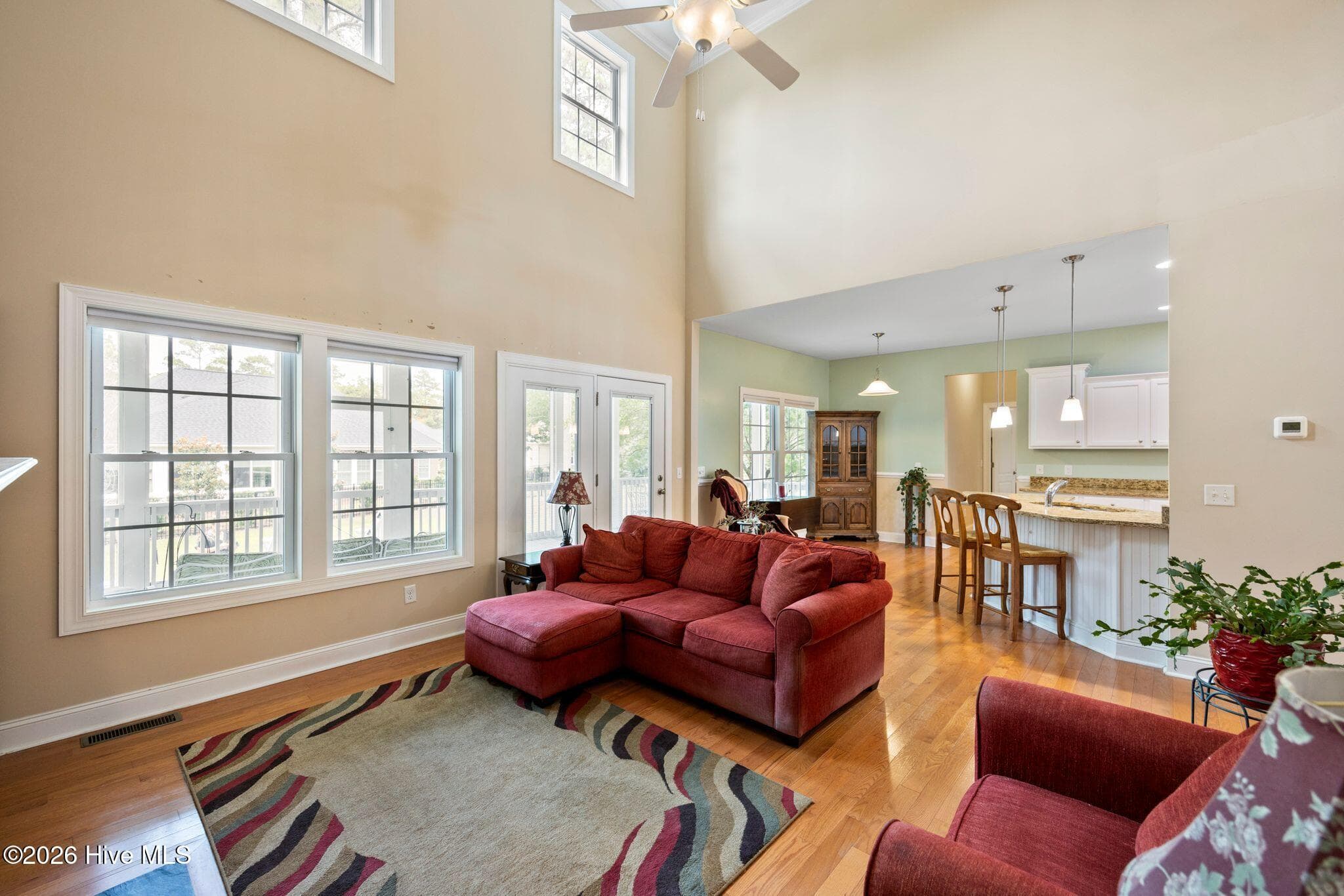 So much natural light! doors to the back deck. - 1620 Golfers Ridge Drive SE, Bolivia, NC 28422