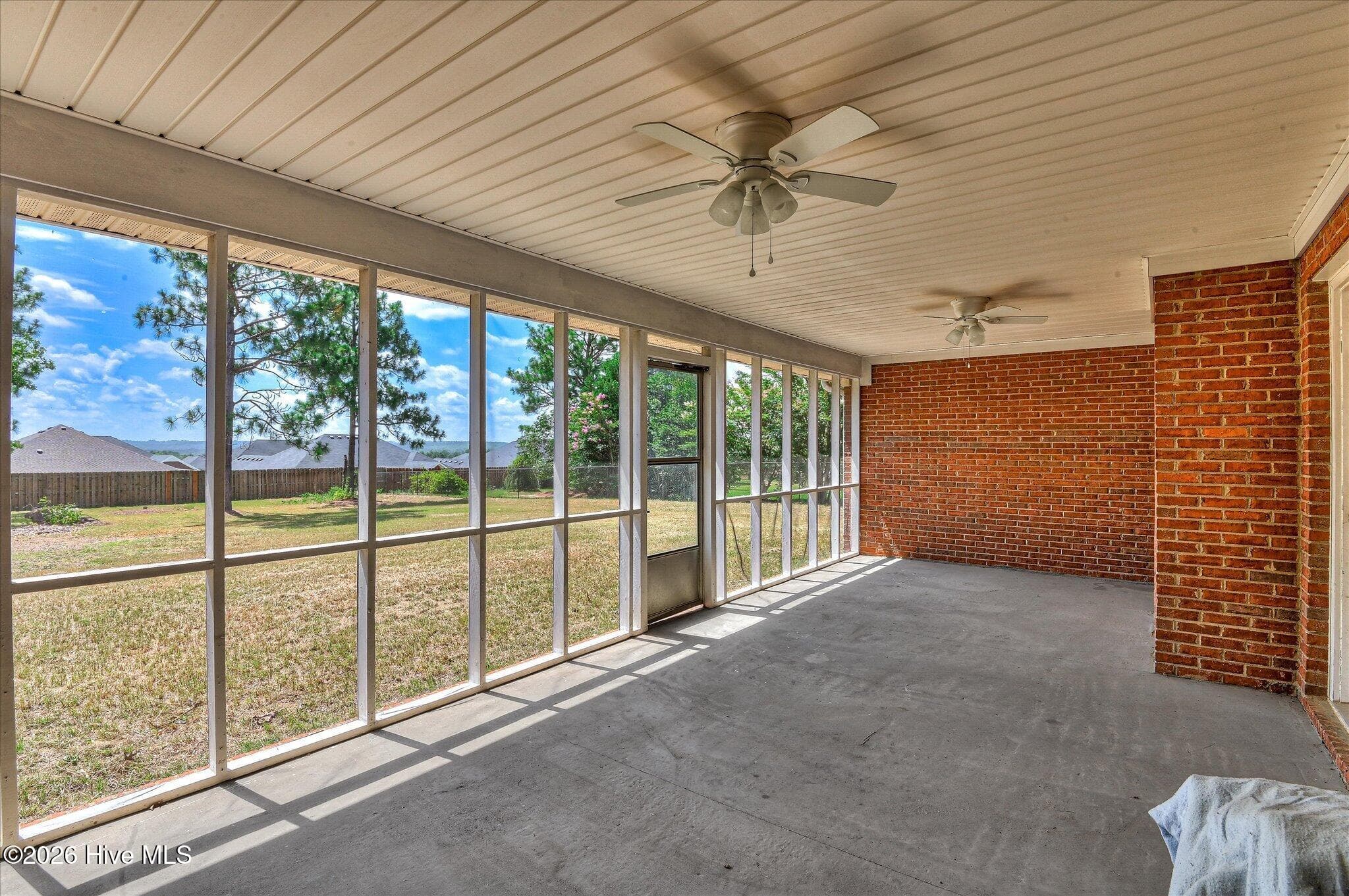 Screen porch with double ceiling fans - 2720 Spirit Creek Road, Hephzibah, GA 30815