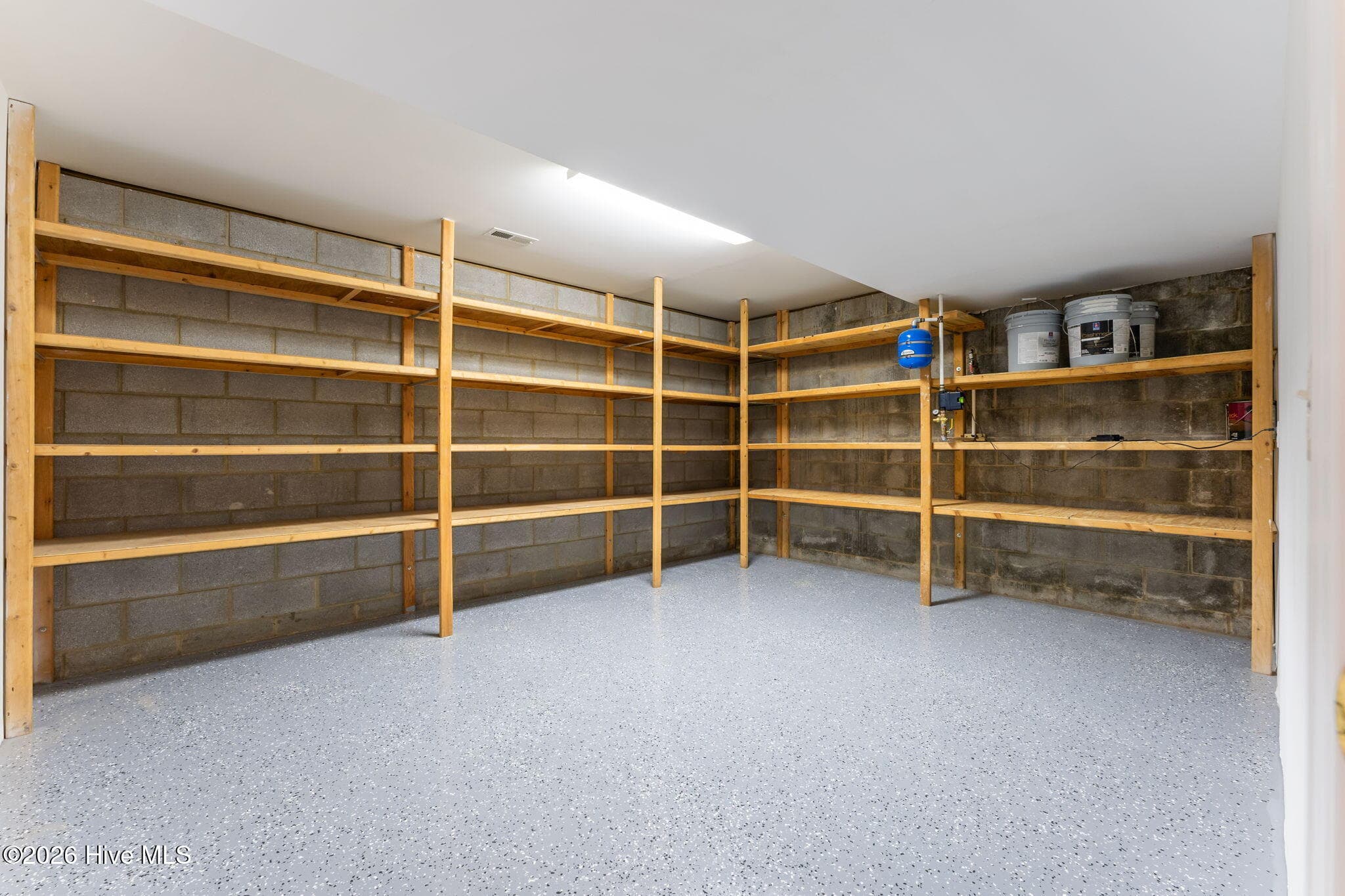 Heated and unfinished Storage area with new epoxy flooring. - 22 Lochmere Drive, Pinehurst, NC 28374