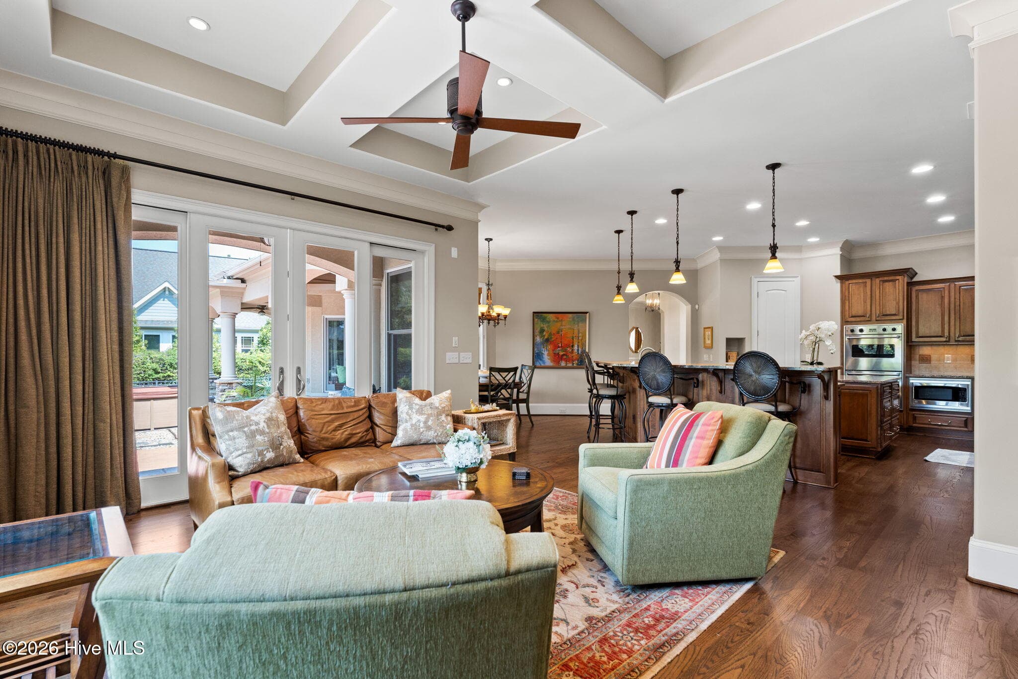 Family room has sliders leading to outdoor area - 3858 Ridge Crest Drive, Southport, NC 28461