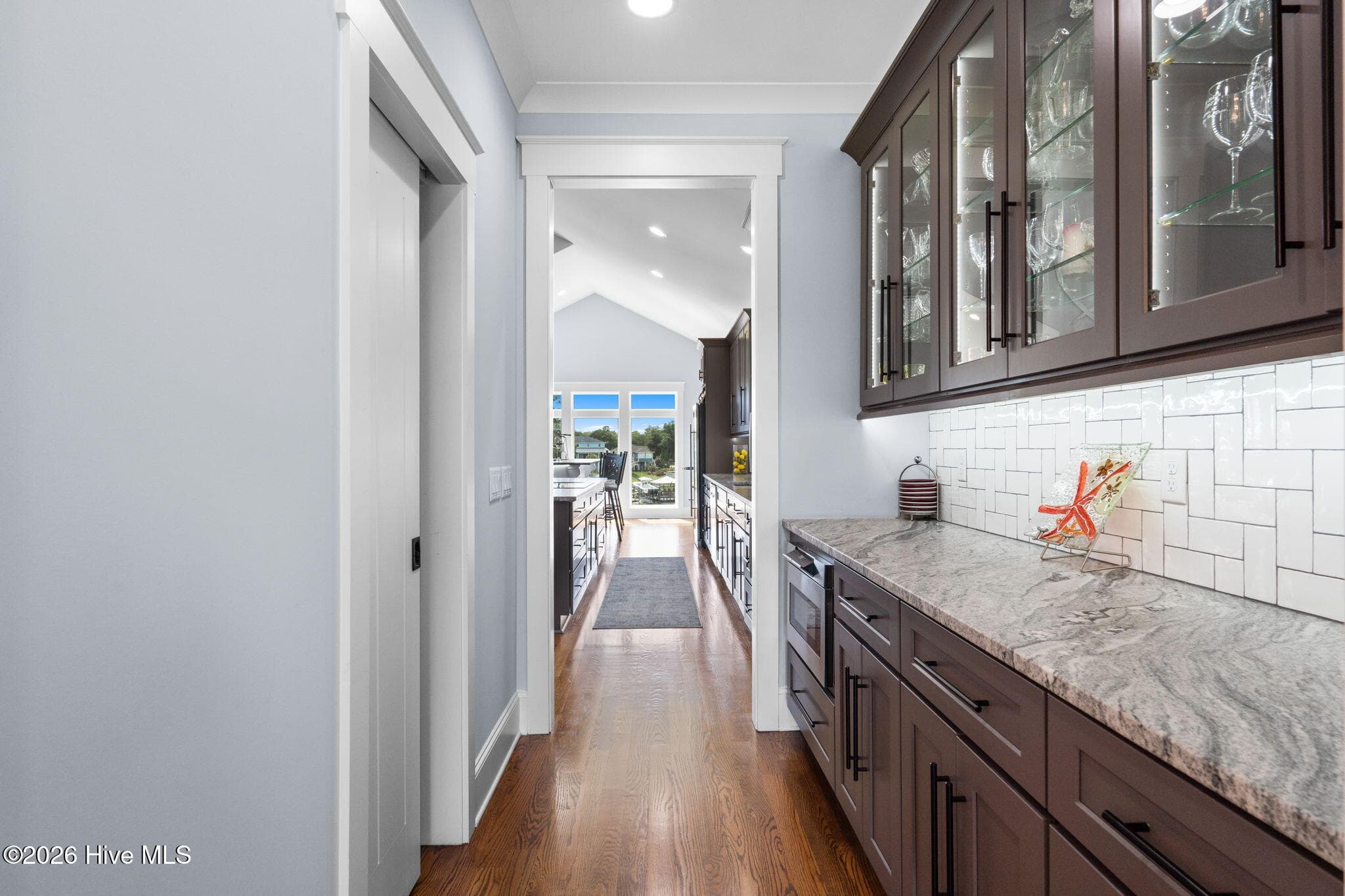 View from dining room. Large counter for food presentation for a dinner or party - 2775 Long Bay Drive SE, Southport, NC 28461