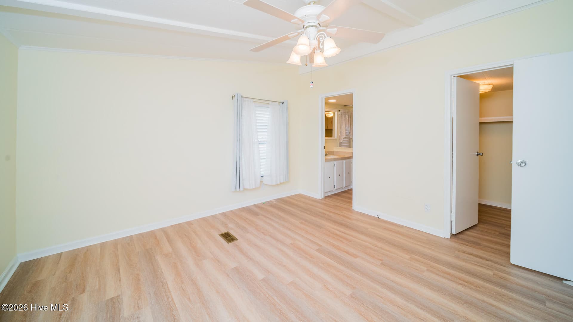 Primary bedroom has a private bath and large walk in closet. - 1076 Clubview Lane SW, Calabash, NC 28467