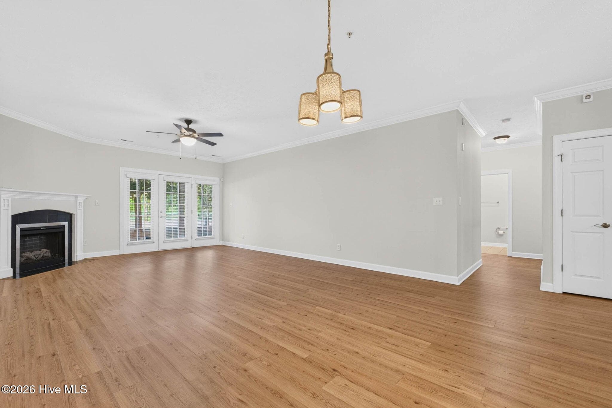 View of dining room and living room - 7825 High Market Street #303, Sunset Beach, NC 28468