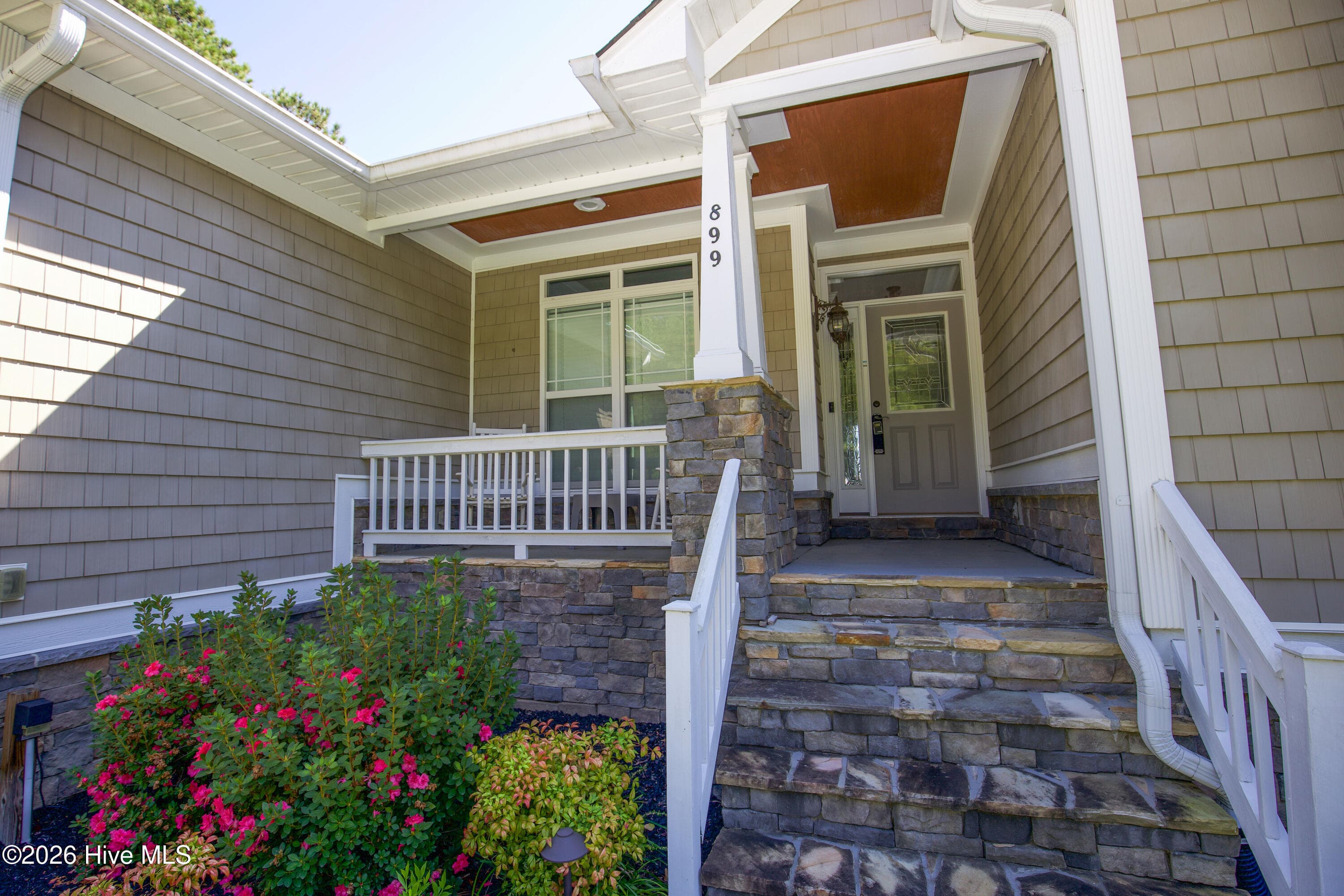 Covered front porch with stone steps at 899 Seagull Drive in Woodlake, Vass NC. - 899 Seagull Drive, Vass, NC 28394, Vass