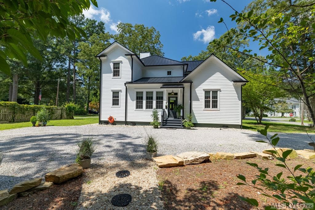 Back view of house & back porch entry
