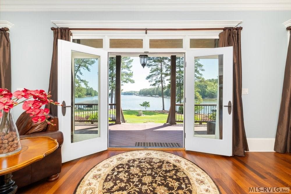 Doorway to Lake Gaston , Seamlessly blend indoor and outdoor living with elegant French doors that open from the living room to reveal a breathtaking, unobstructed view of Lake Gaston—the perfect backdrop for morning coffee o - 381 West Bend Dr., Gasburg VA 23857, Gasburg