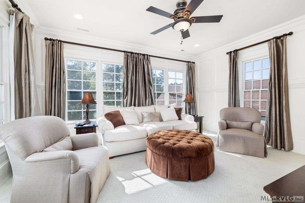 Sun-Drenched Living Area, Step into this bright and airy living space, where expansive windows flood the room with natural light. - 381 West Bend Dr., Gasburg VA 23857, Gasburg