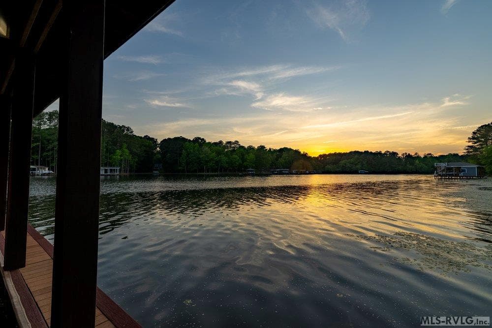 Golden Hour View, The perfect blend of natural beauty and peaceful lakeside living captures the true essence of tranquility. - 381 West Bend Dr., Gasburg VA 23857, Gasburg