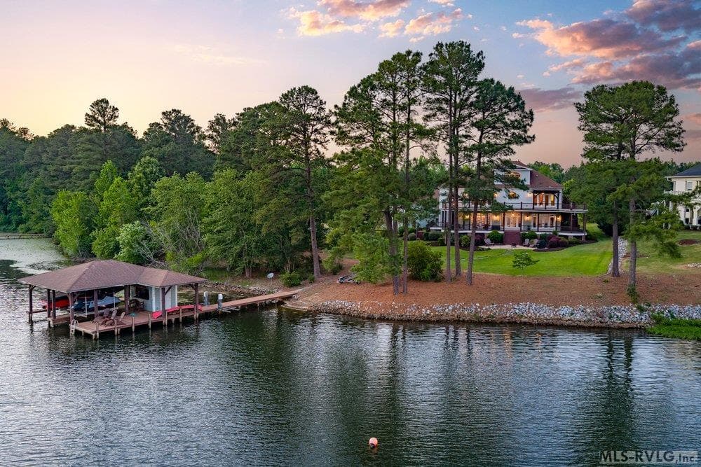 Golden Hour Getaway, Imagine launching your kayak at dawn or toasting the sunset from your private boathouse. Here, life is measured in ripples and reflections, not minutes. - 381 West Bend Dr., Gasburg VA 23857, Gasburg
