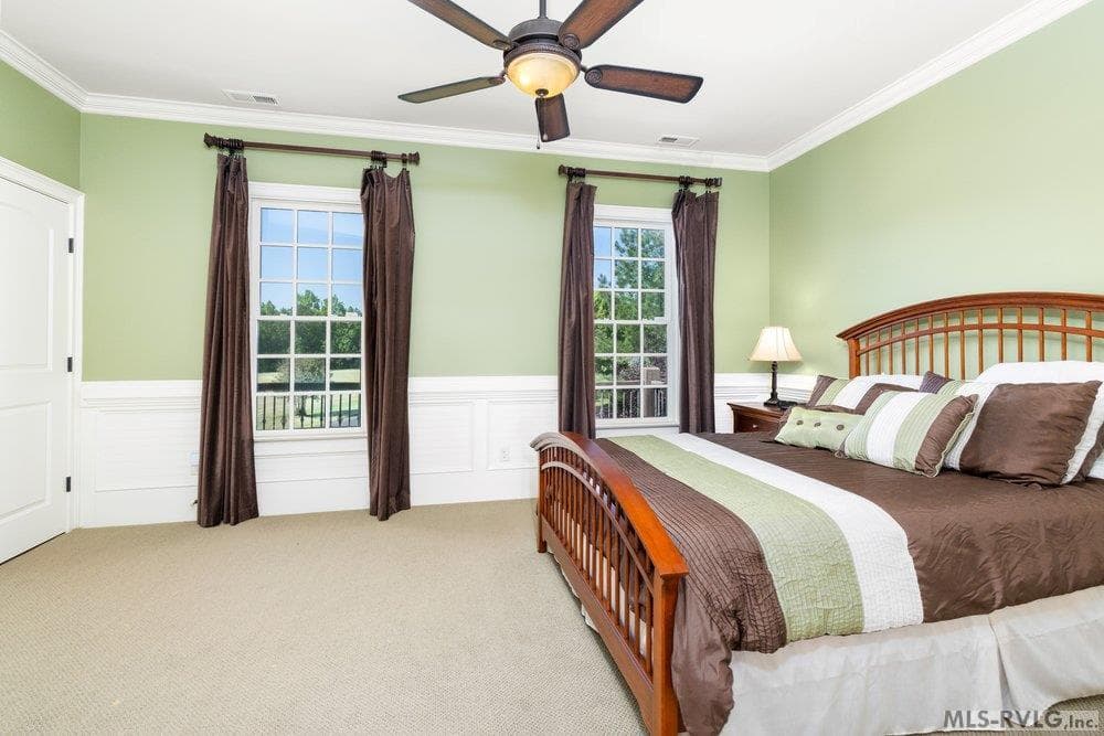 Upper Level Road Side Bedroom, A perfect getaway for family and friends, offering a view of the expansive, beautifully manicured lawn. - 381 West Bend Dr., Gasburg VA 23857, Gasburg