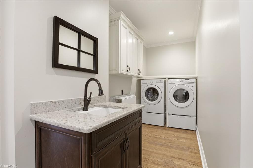 Main level laundry has everything you need: storage, folding center and sink! - 2027 Fairview Circle, Wilkesboro NC 28697, Wilkesboro