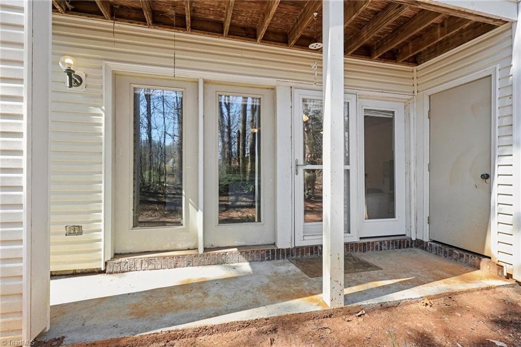 rear porch with storage to right. - 2326 W Vandalia Road # B, Greensboro NC 27407, Greensboro