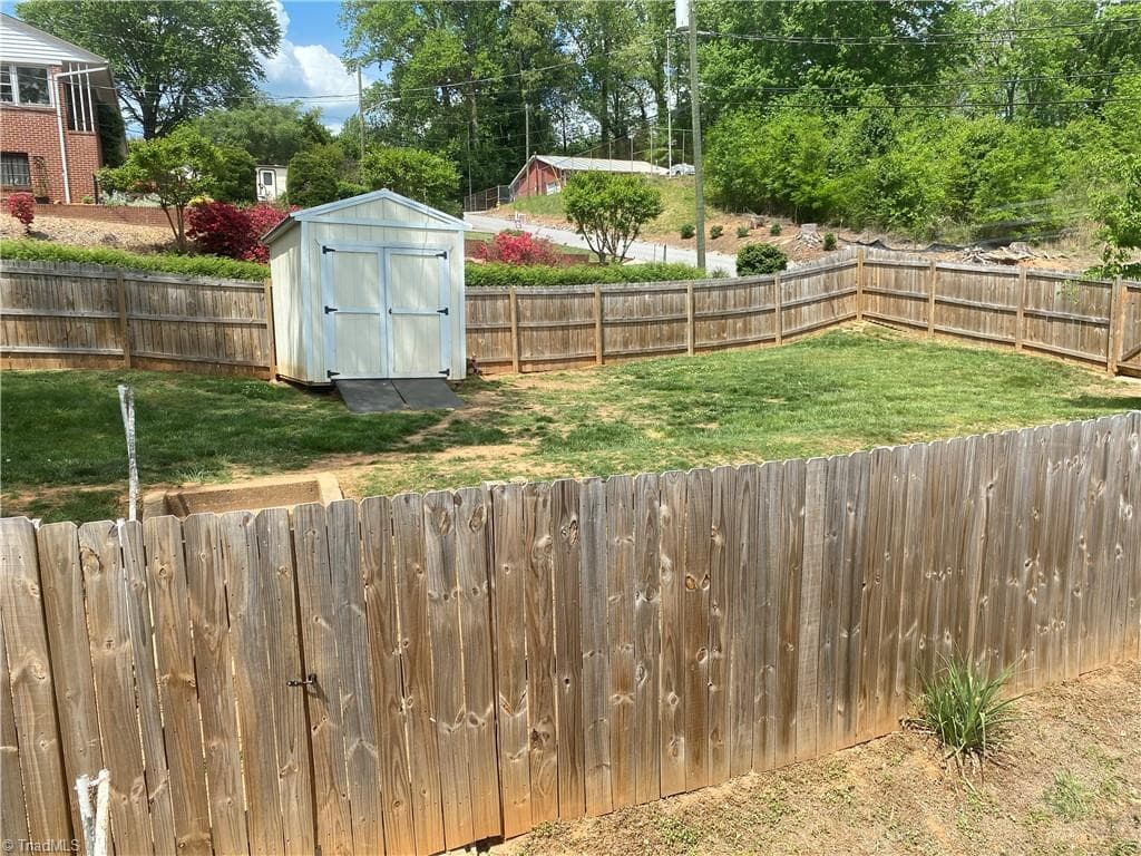 Fenced bak yard for pets or kids.  Storage building remains - 500 W Main Street, Wilkesboro NC 28697, Wilkesboro