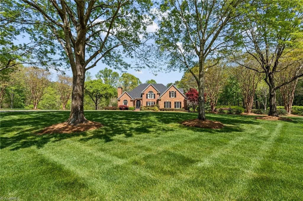 Professionally designed landscaping with irrigation system in place - 11555 Double Spring Road, Lewisville NC 27023, Lewisville