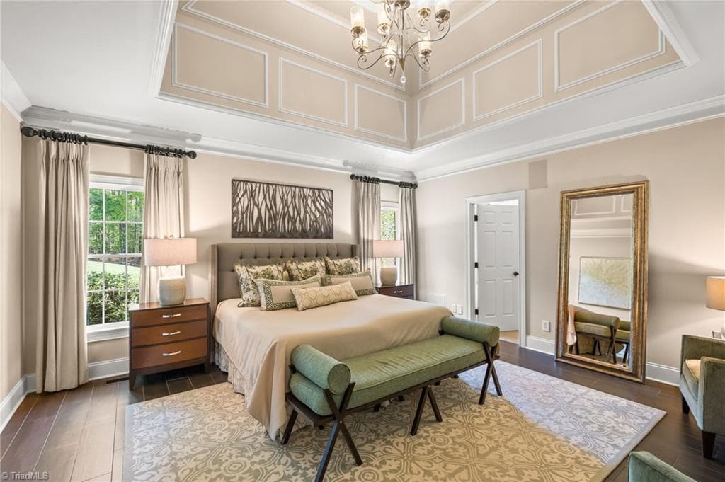 Spacious primary retreat with tray ceiling and chandelier - 11555 Double Spring Road, Lewisville NC 27023, Lewisville