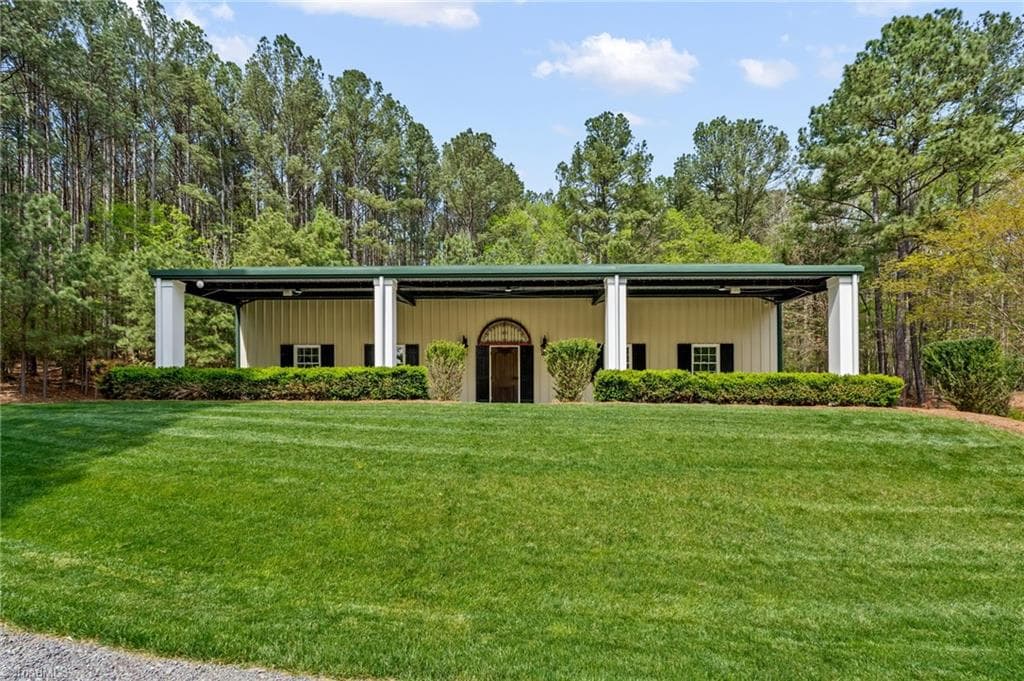 60x40 insulated building with covered patio overlooks the pond - 11555 Double Spring Road, Lewisville NC 27023, Lewisville