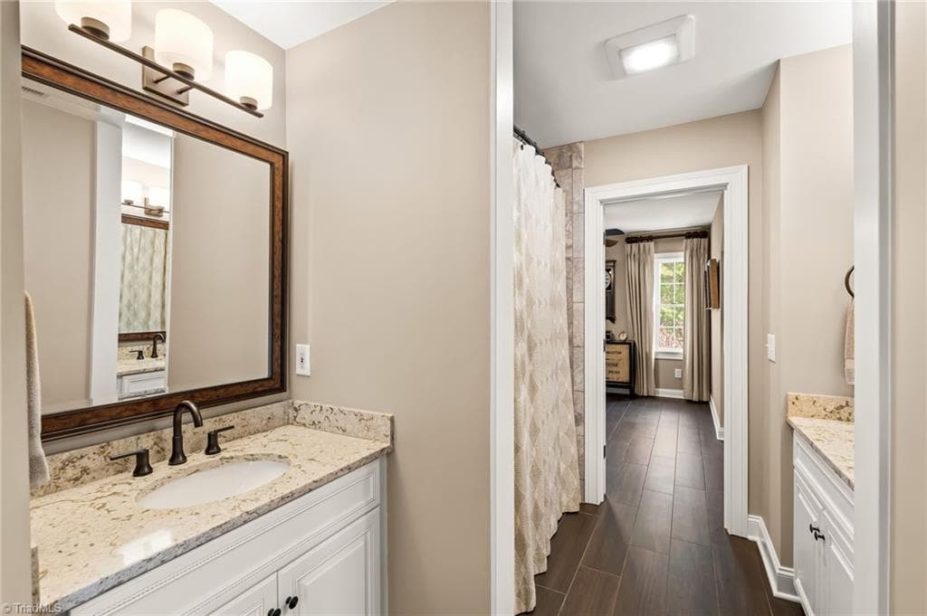 This Jack and Jill bathroom caters to the 4th bedroom and the bonus room - 11555 Double Spring Road, Lewisville NC 27023, Lewisville